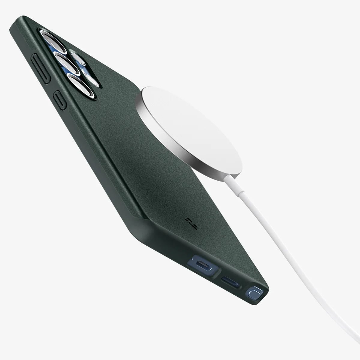 Groene telefoonhoes met een witte oplader bevestigd.