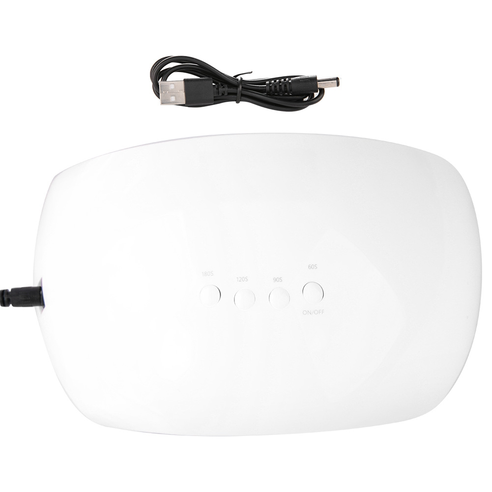 Weiße, ovale Nagellampe mit Knöpfen und USB-Kabel. Schwarzes Kabel und Stecker links.