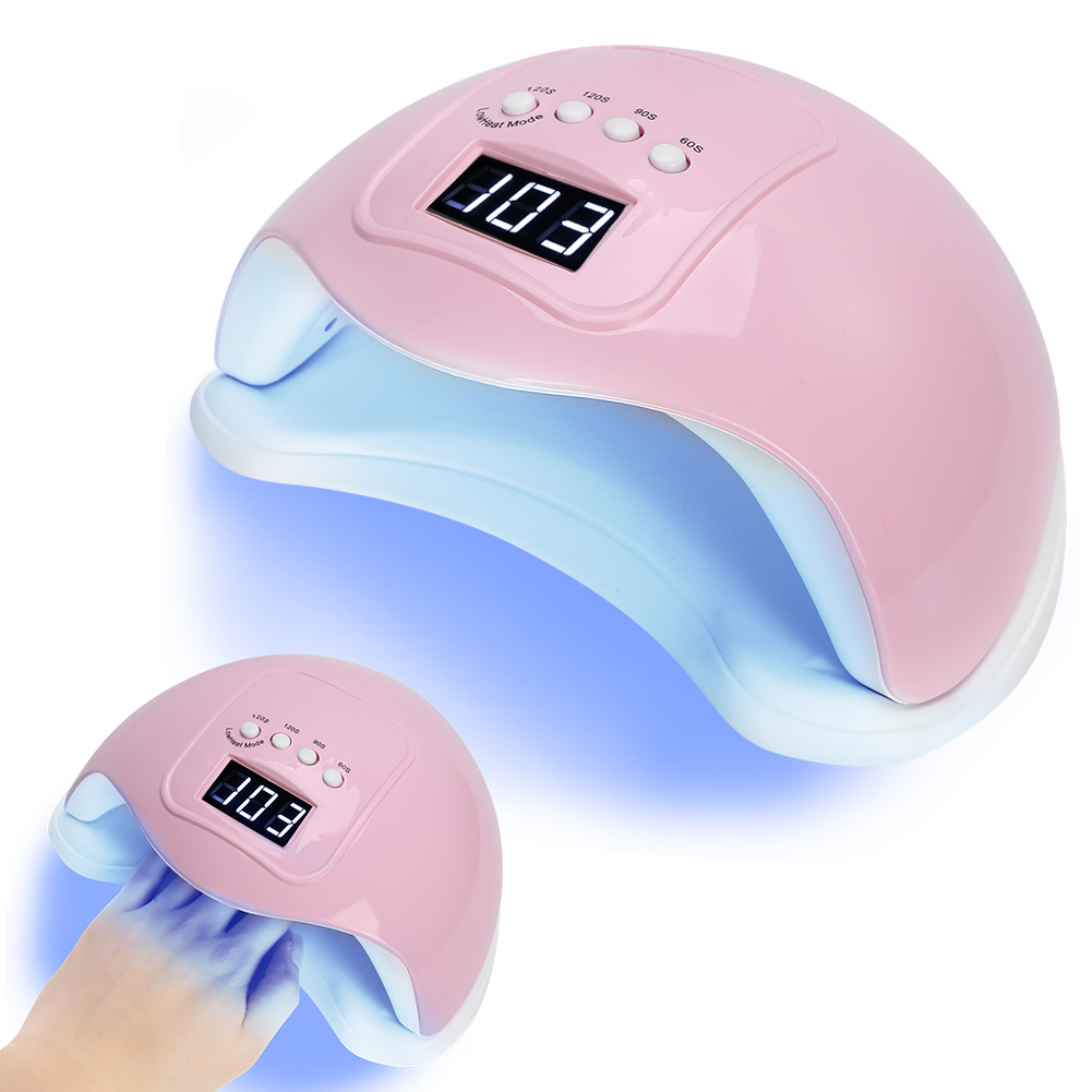 Ein rosa Nageltrockner mit Digitalanzeige und einer Hand, die Nägel trocknet.