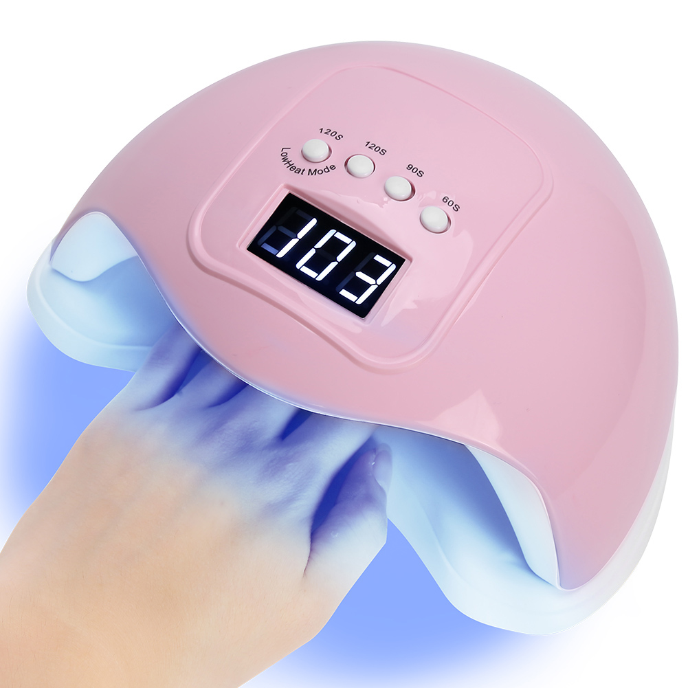 Pinkfarbene Nagellampe mit Hand. Anzeige zeigt 103. Knöpfe 120s, 90s, 60s. Weißer Sockel und blaues Licht.