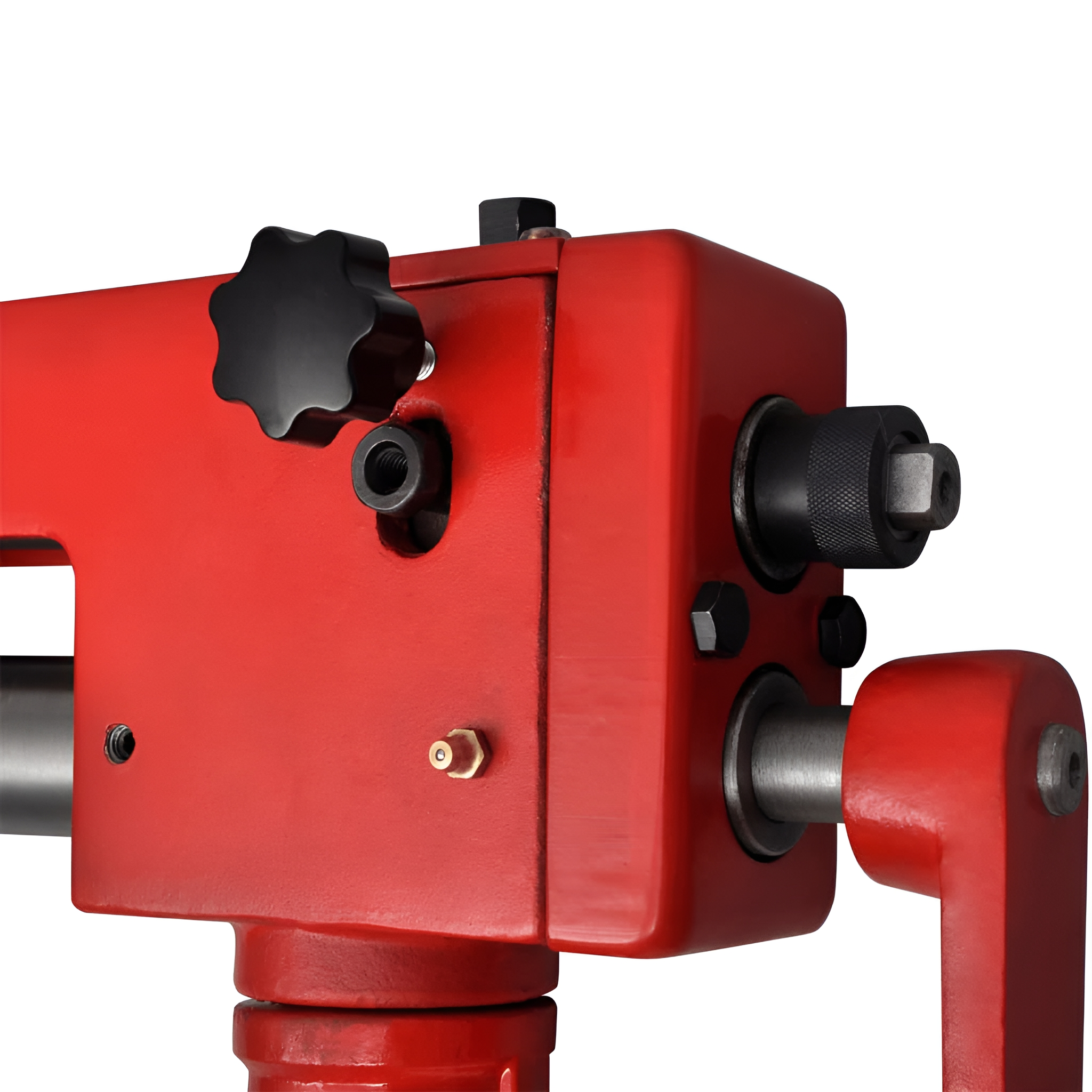 Nahaufnahme einer roten Metallmaschine, die einen schwarzen Knopf und verschiedene Komponenten zeigt.