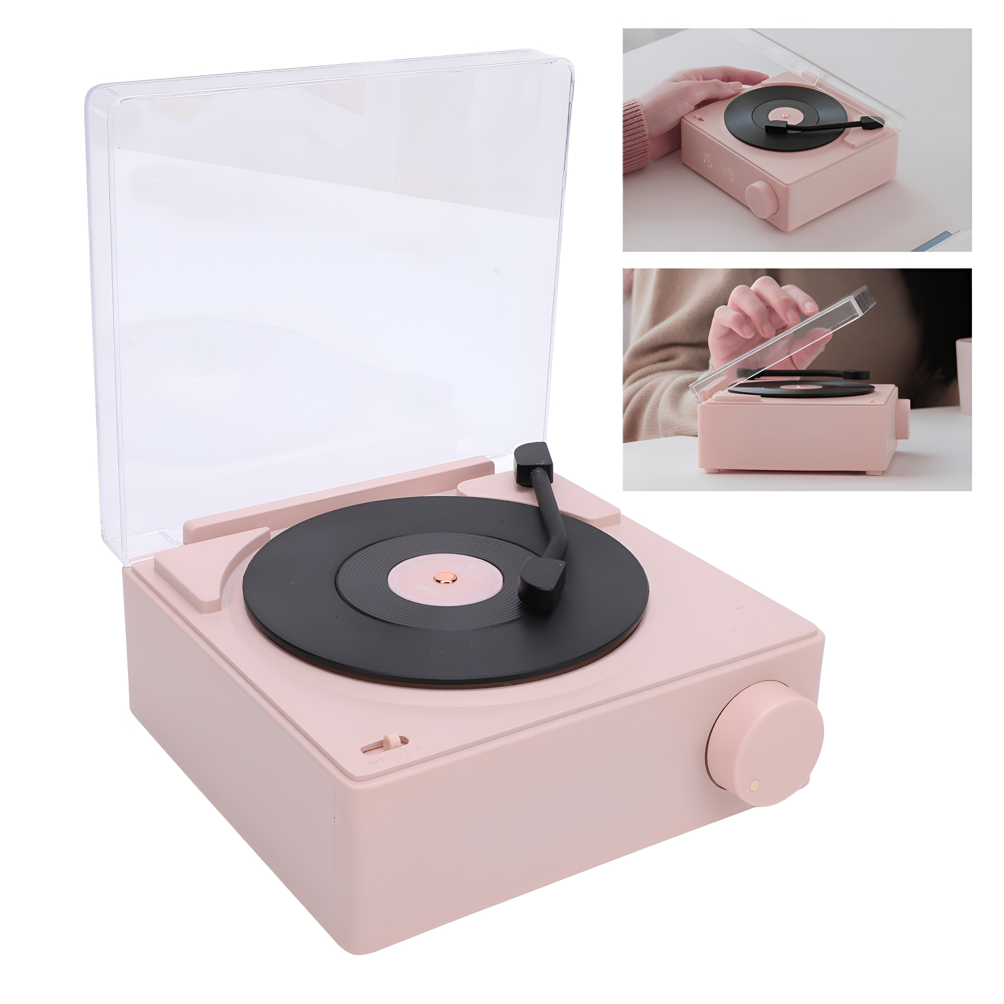 Ein pinkfarbener Plattenspieler im Retro-Stil mit transparentem Deckel, Schallplatte und Knopf.