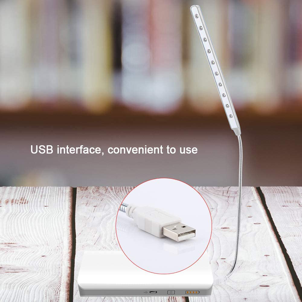 Eine USB-LED-Leuchte mit USB-Schnittstelle, platziert auf einem Holztisch.