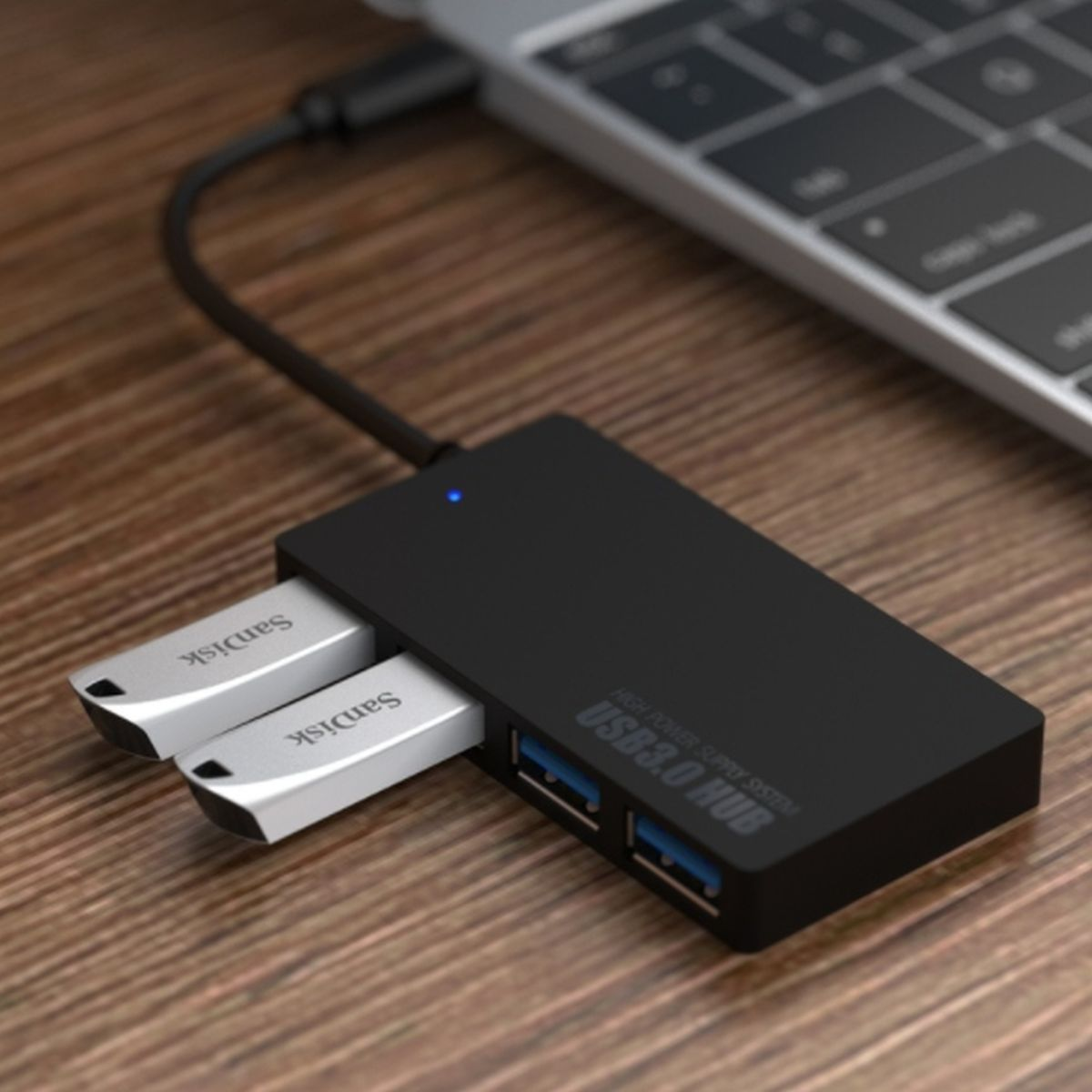 Czarny hub USB 3.0 z dwoma dyskami USB i laptopem.