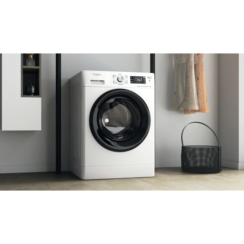 White washing machine with a black door and a black bag.