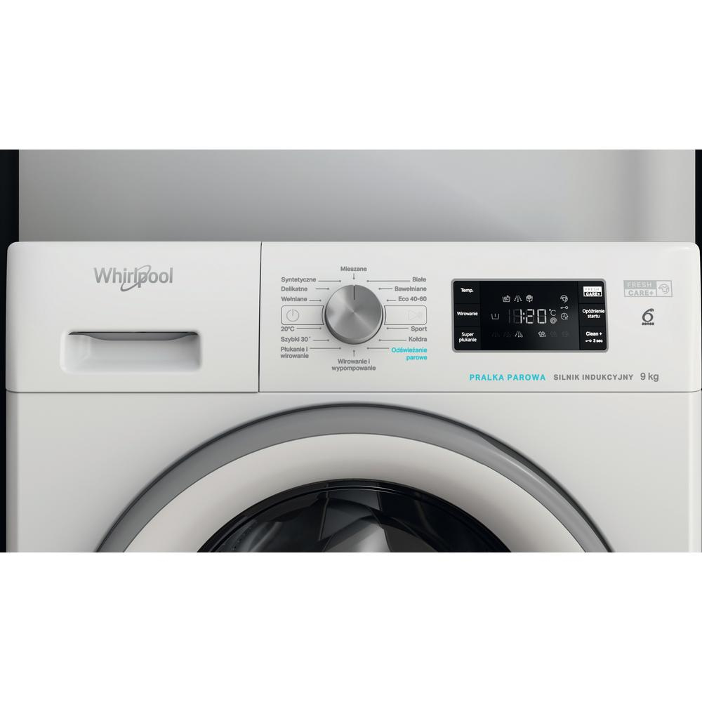 Nahaufnahme des Bedienfelds einer weißen Waschmaschine mit Drehknopf und Anzeige.