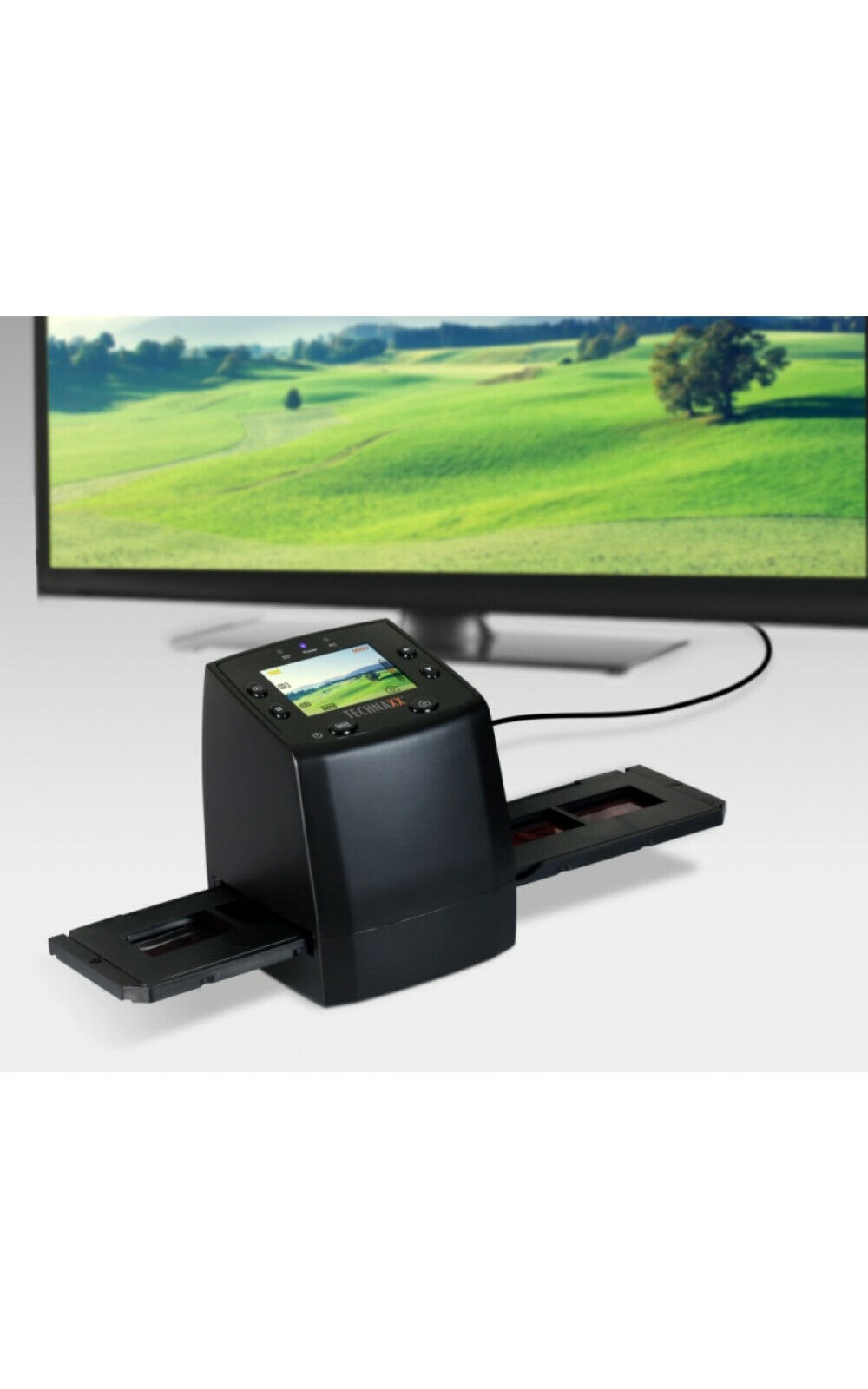 Ein schwarzer Scanner steht auf einem Tisch. Ein großer Bildschirm zeigt ein grünes Feld.