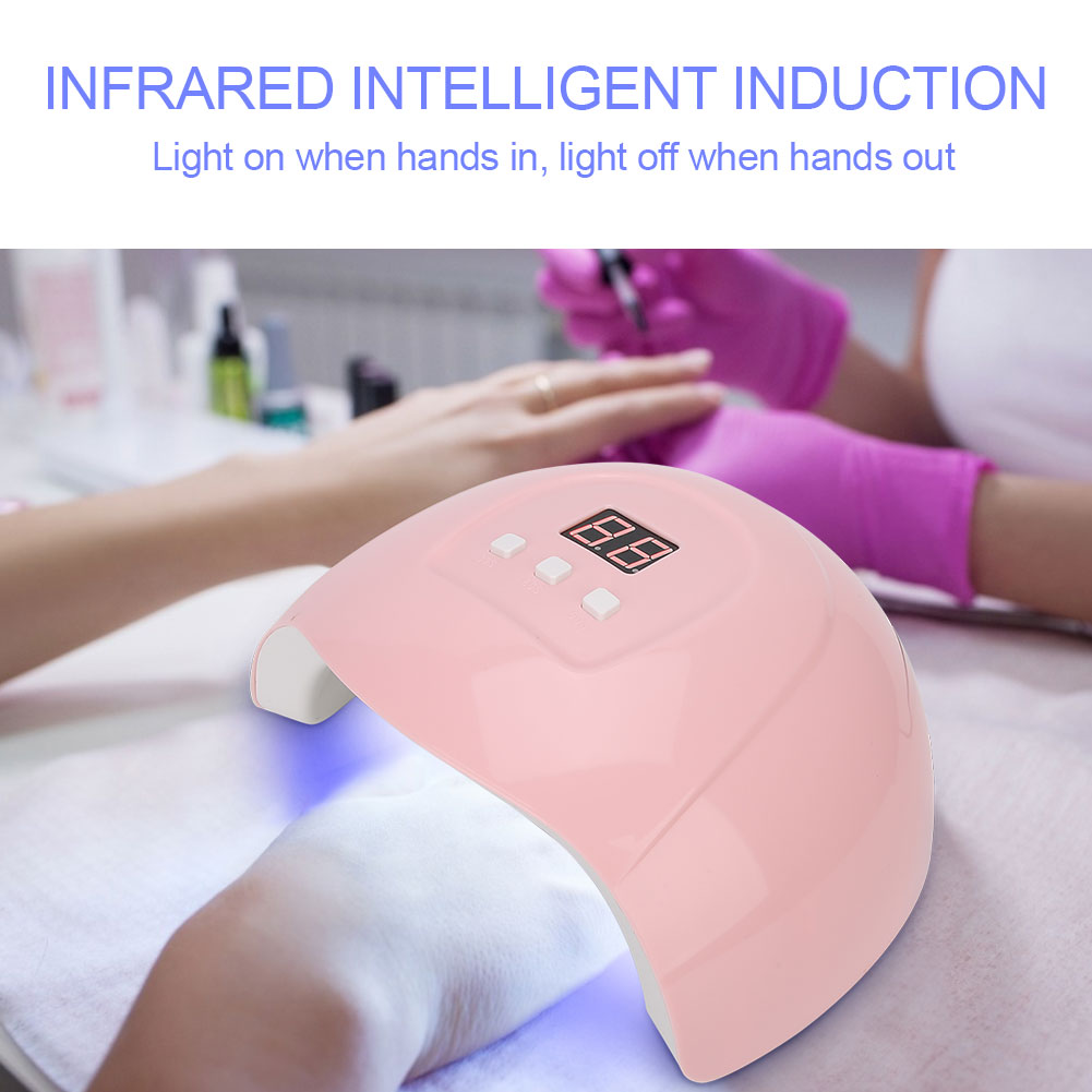 Ein rosa Nageltrockner mit Digitalanzeige, Hände sind innen, Text: "INFRARED INTELLIGENT INDUCTION".