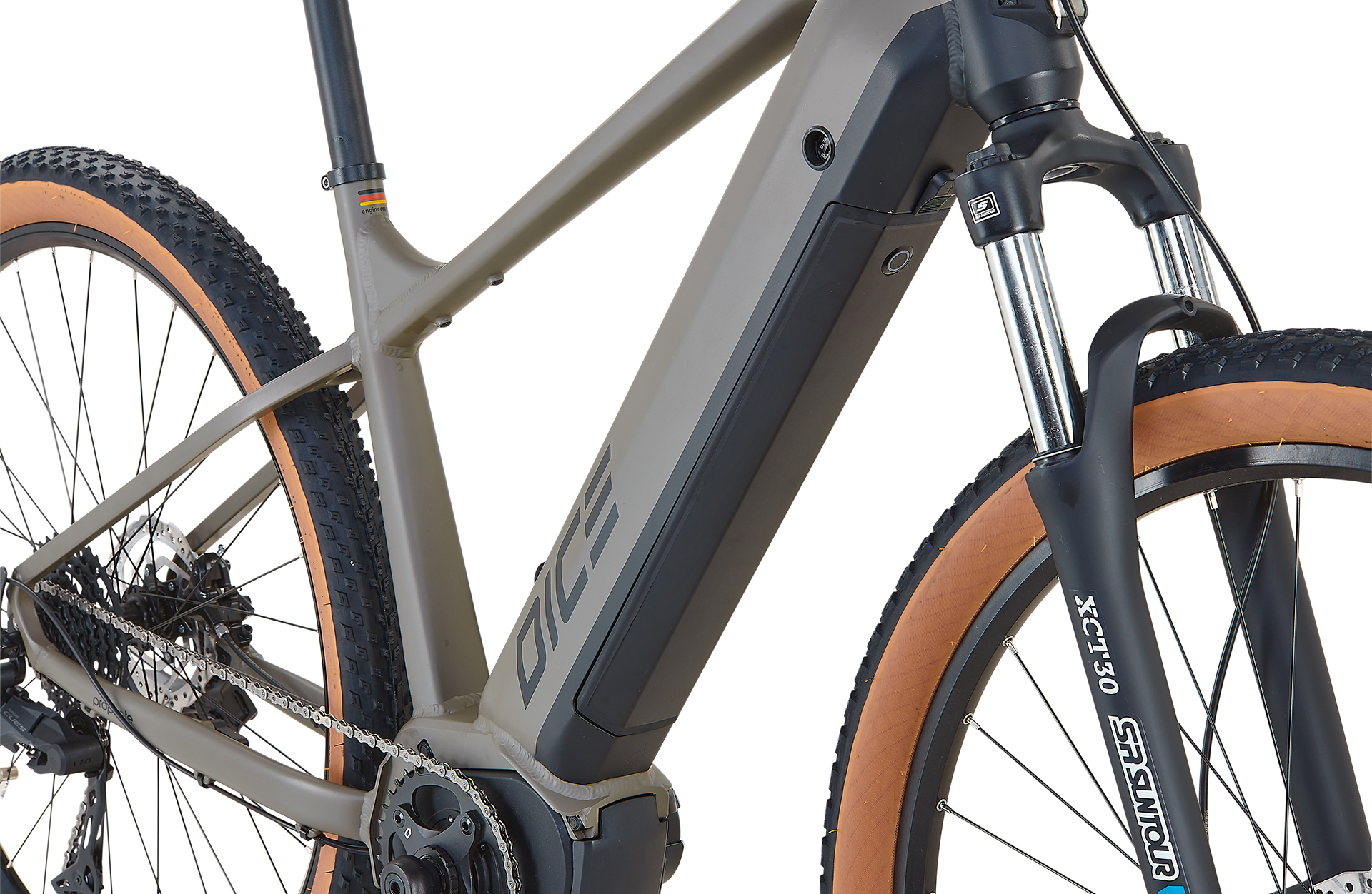 Ein Fahrrad mit grauem Rahmen und braunen Reifen, mit sichtbarem Akkupack.