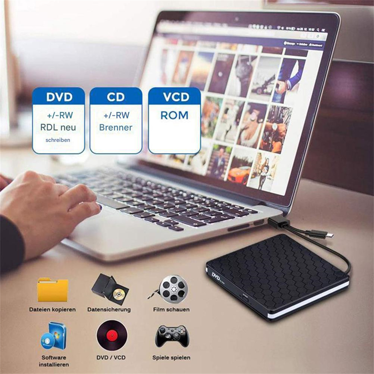 Ein Laptop ist mit einem schwarzen externen DVD/CD-Laufwerk verbunden, mit Software-Icons und DVD.