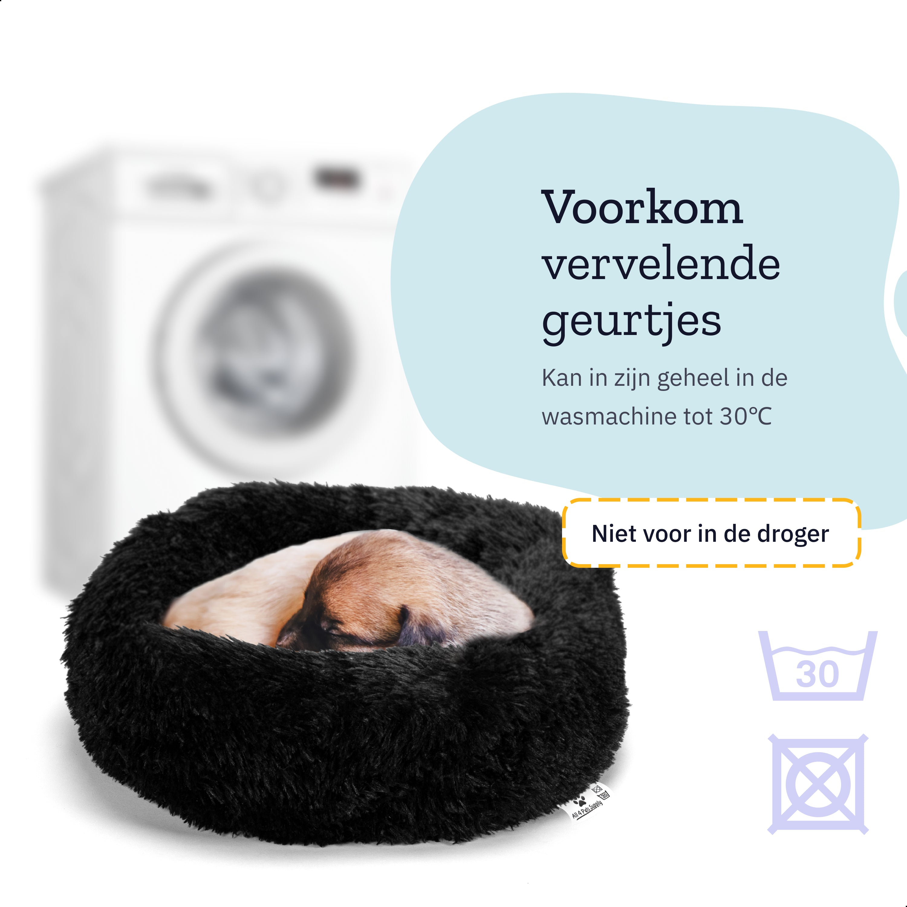 A small dog sleeping in a black fluffy dog bed, with a washing machine blurred in the background.