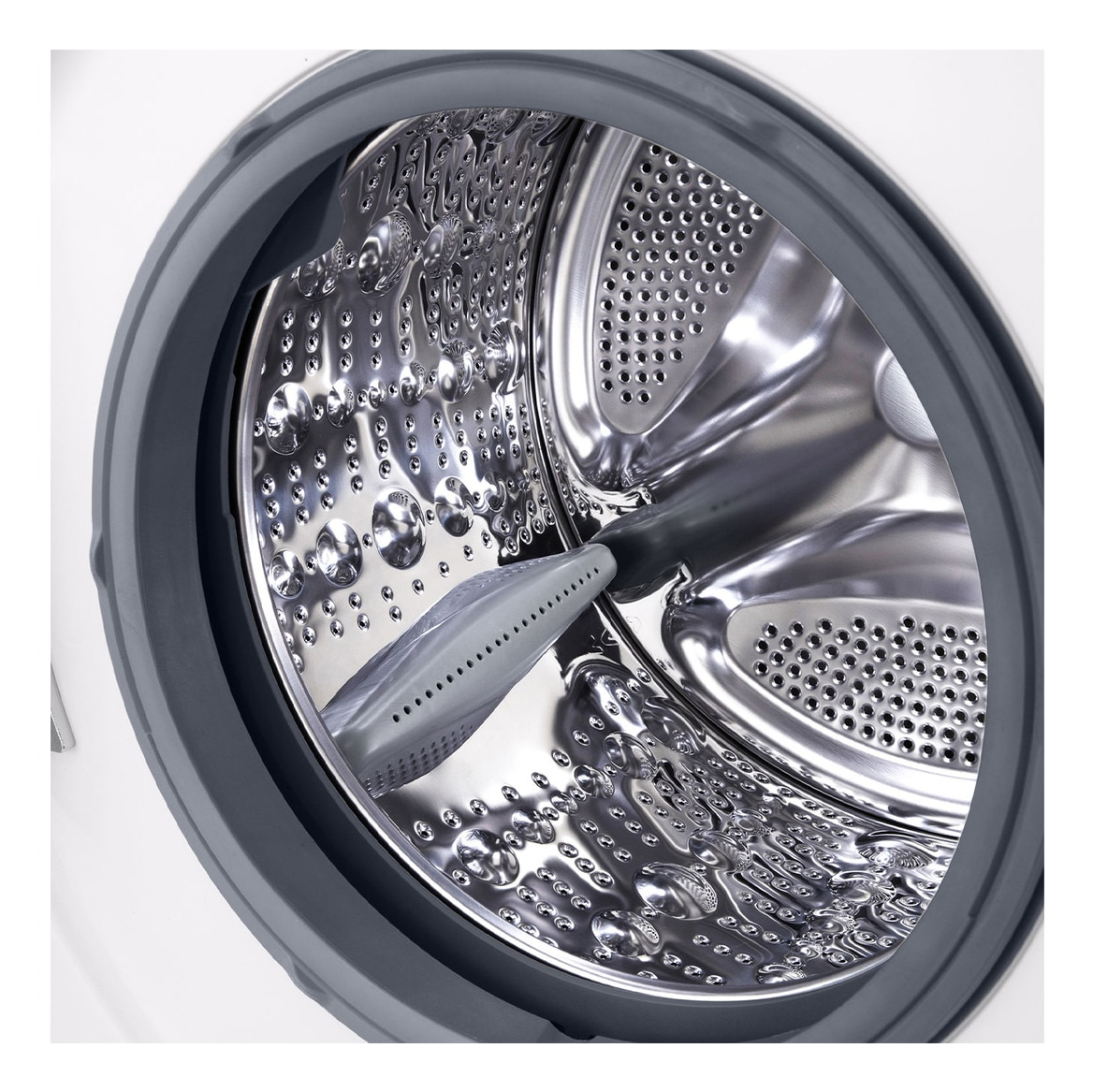 Wnętrze bębna pralki. Perforowana stal nierdzewna. Szara gumowa uszczelka na obrzeżu.