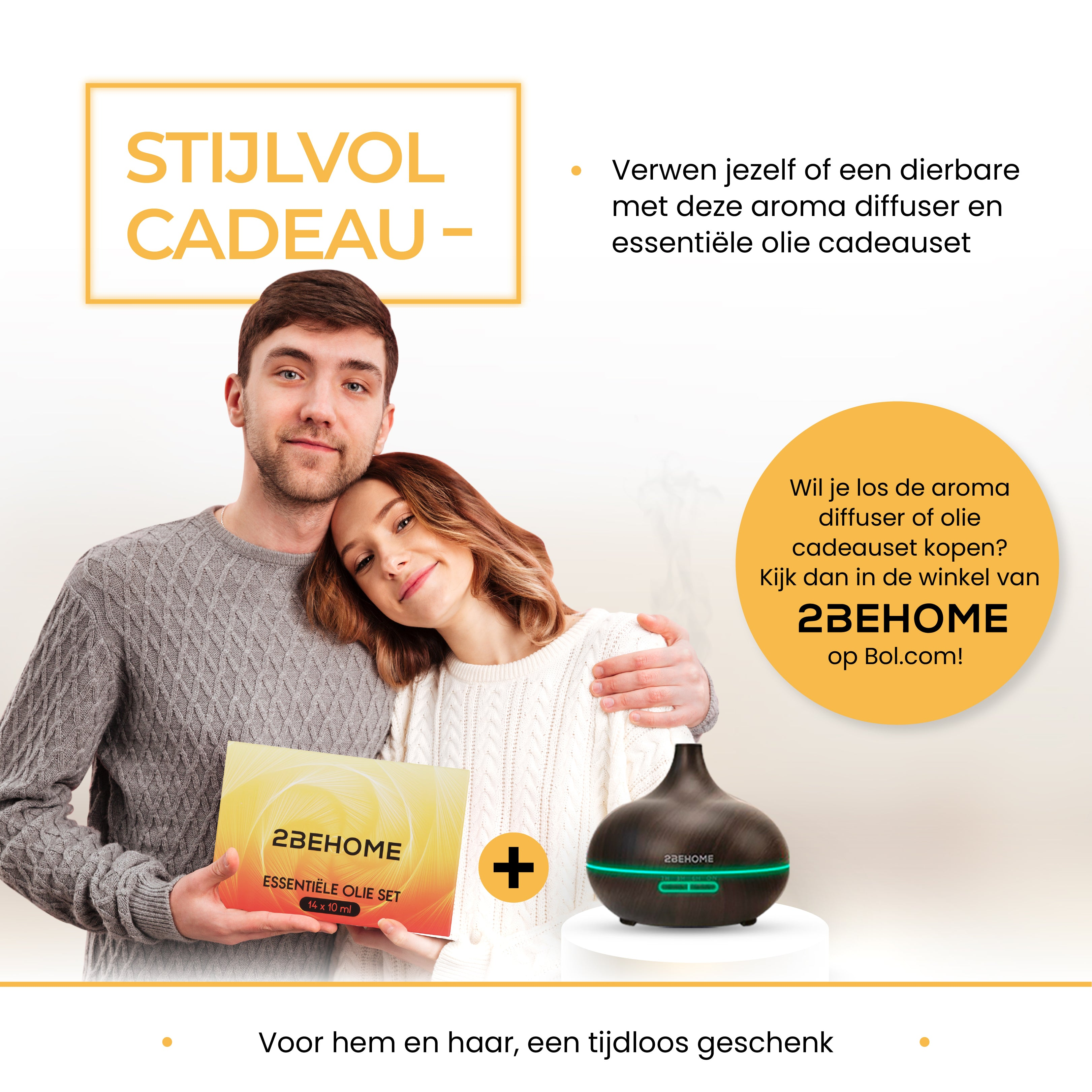 Couple embracing next to a gift box and aroma diffuser on a white surface with text.