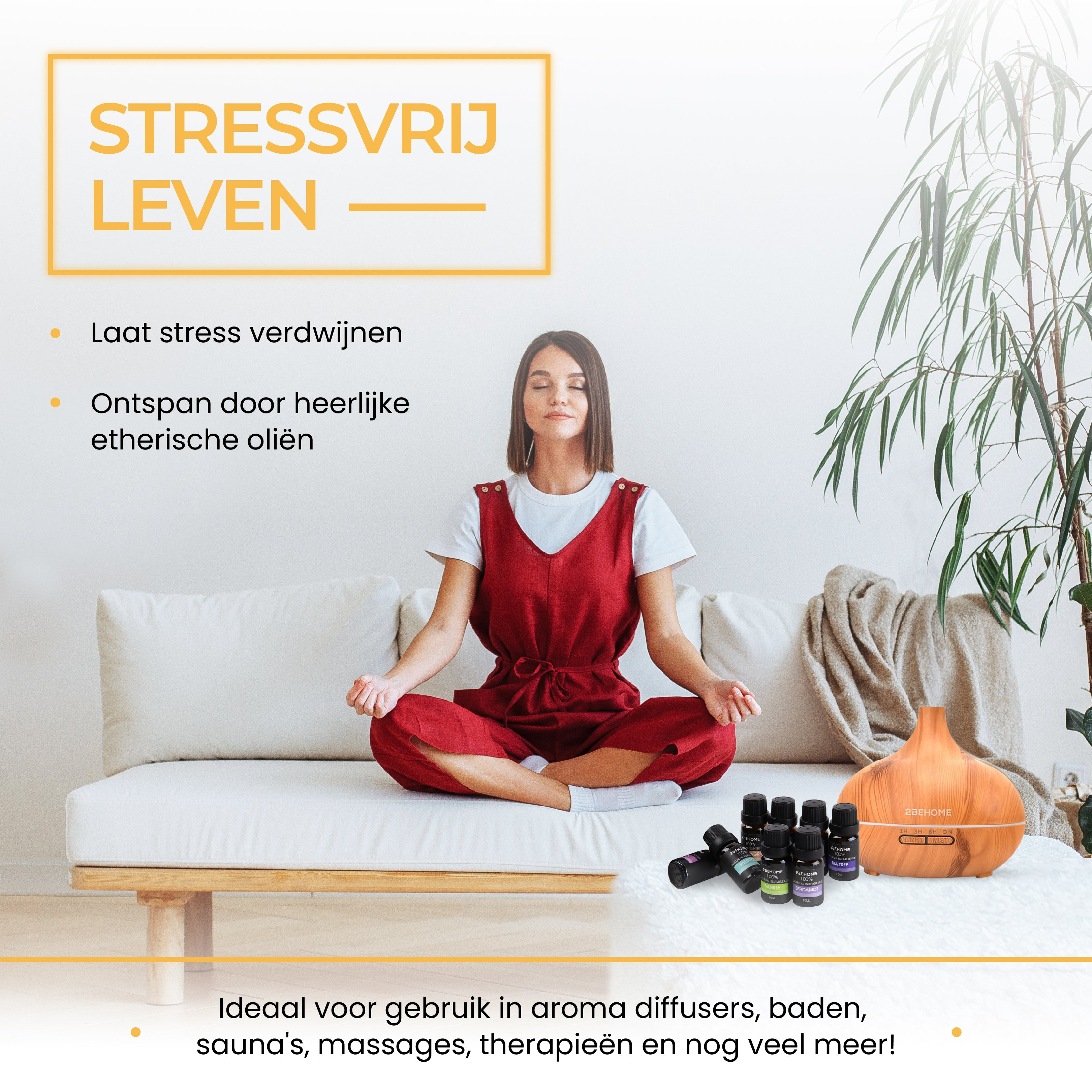 Woman in red jumpsuit meditates on a white sofa. Aromatherapy diffuser and oils are in the foreground.
