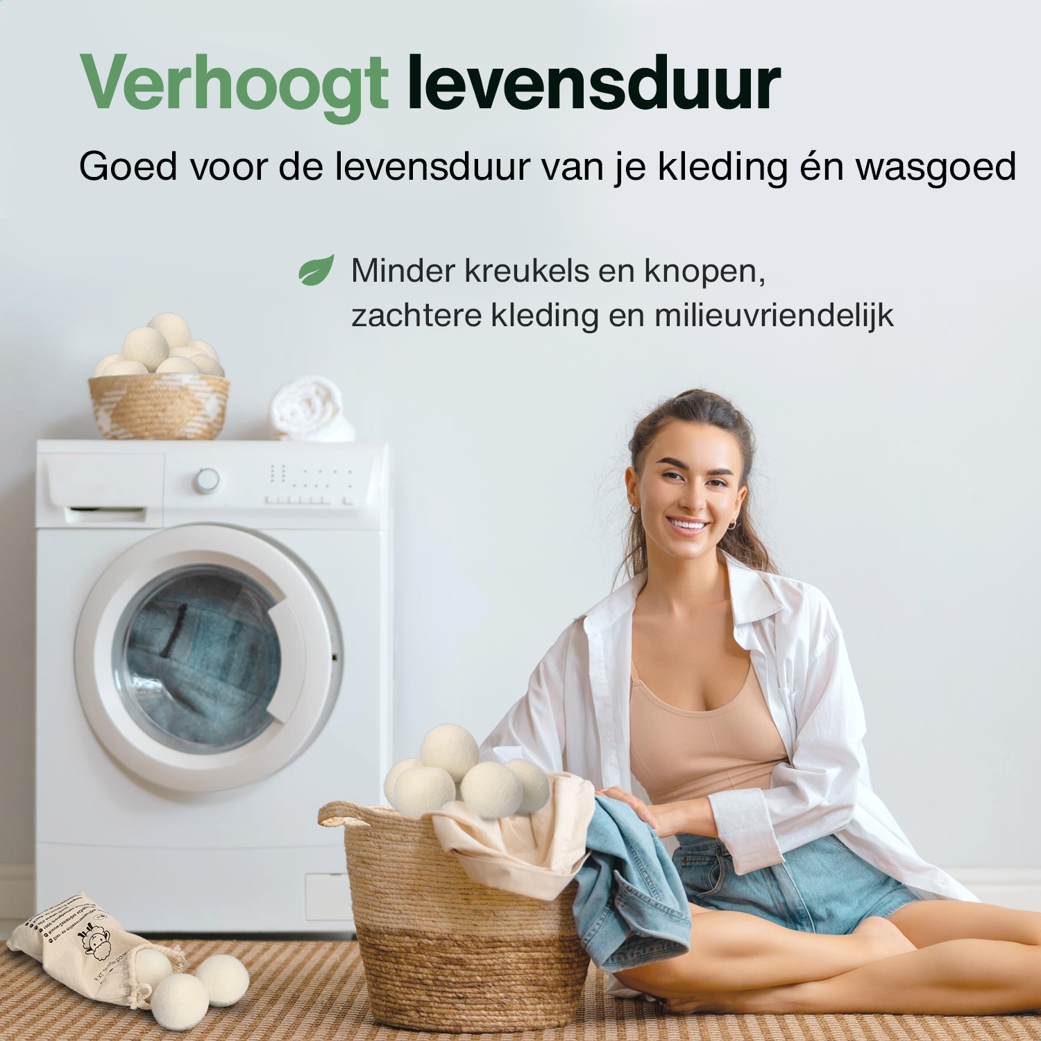 A woman smiling by a washing machine with laundry balls and a basket.