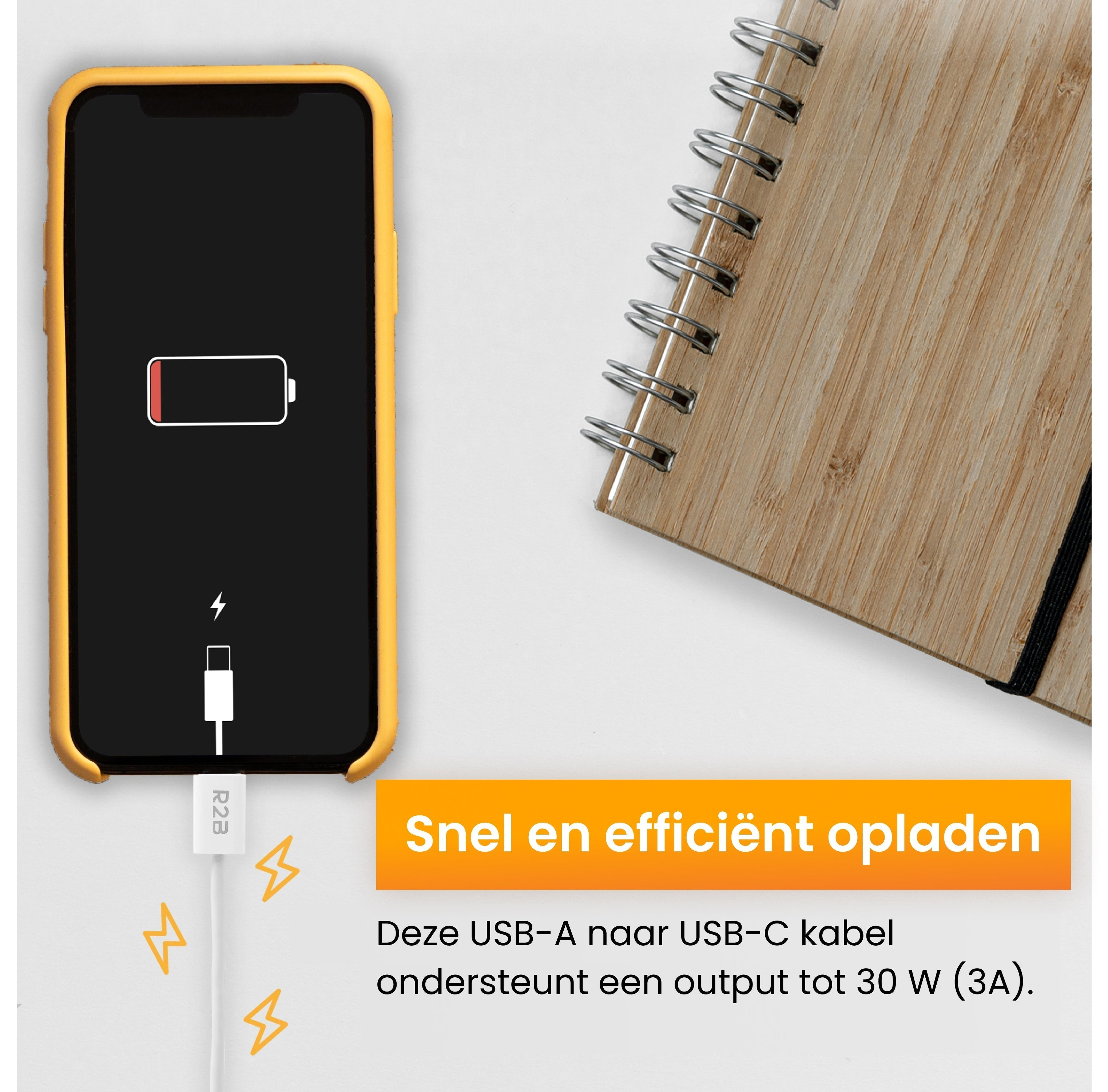 A phone with a charging cable, battery low, and a notebook.