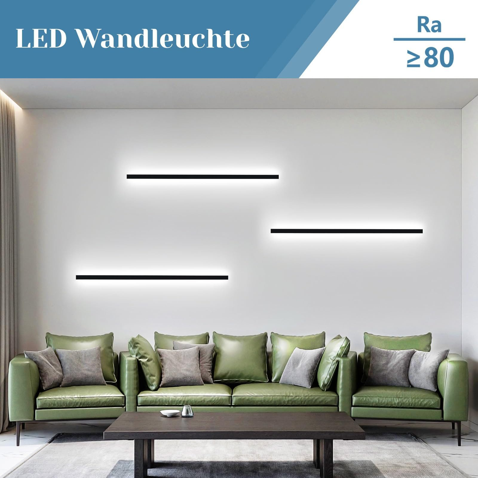 Tre lampade da parete a LED nere sopra un divano verde in una stanza bianca.