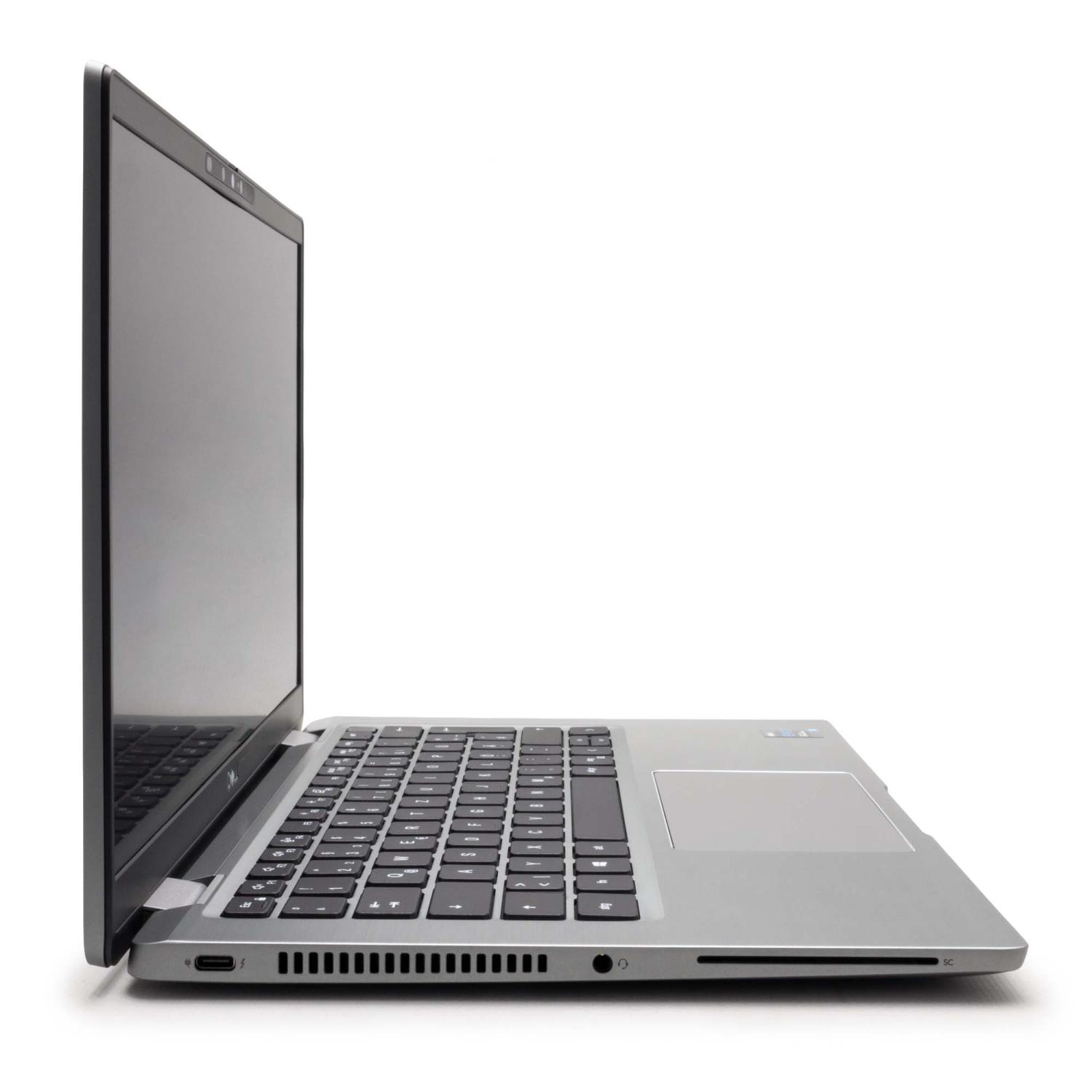 Ein silberner Laptop im Profil, der die Tastatur, den Bildschirm und die Anschlüsse zeigt.