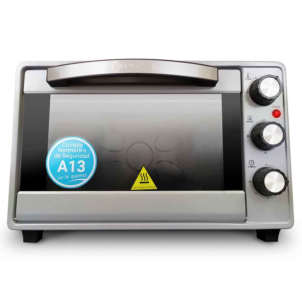 Un forno da banco argentato. Ha una porta a vetro e manopole per temperatura, modalità e timer.