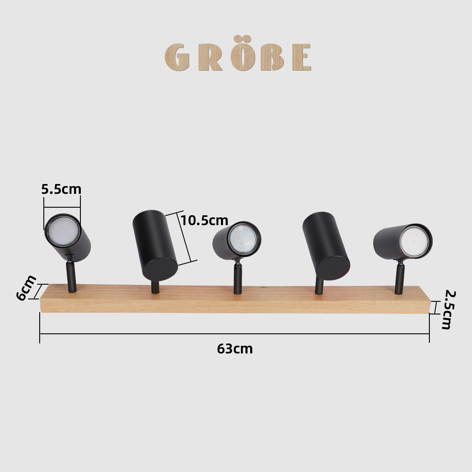 Quattro faretti neri su una trave di legno. Vengono fornite le dimensioni. La parola 'GRÖBE' è in alto.