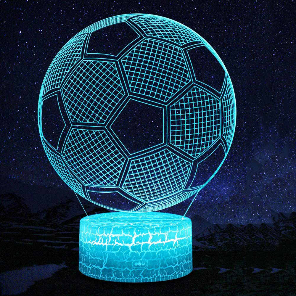 Eine blaue fußballförmige Lampe mit rissigem Sockel. Sie befindet sich vor einem Sternenhimmel.