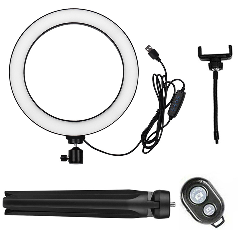 Ein Ringlicht mit Telefonhalter und Fernbedienung. Das Ringlicht hat ein USB-Kabel.
