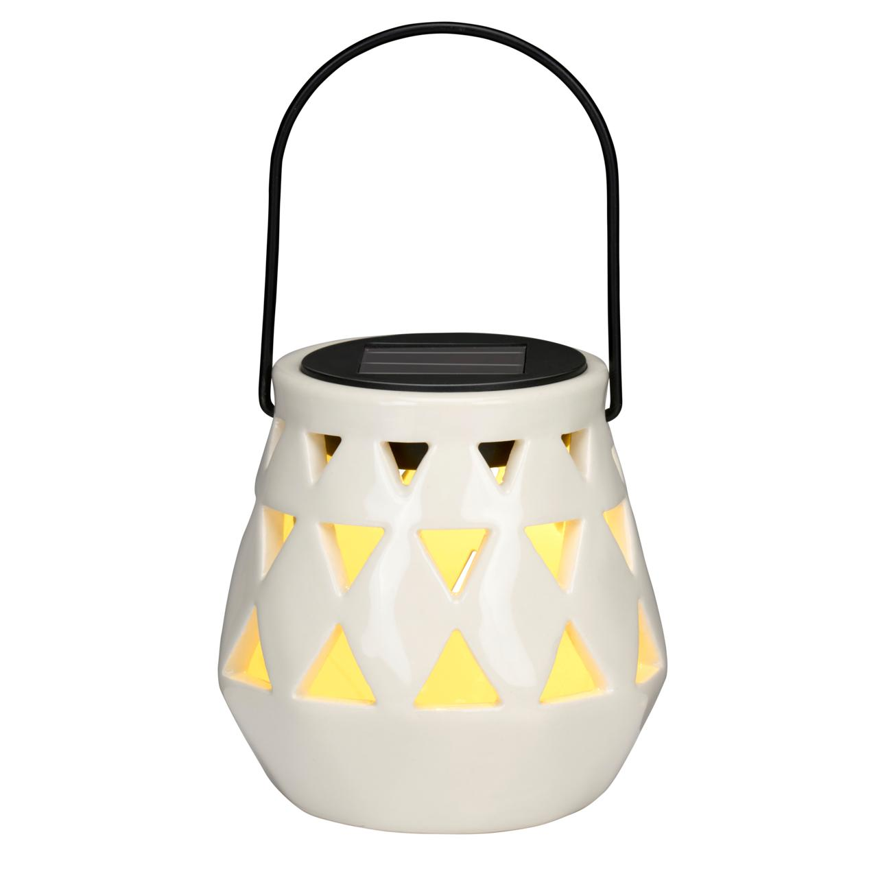 A white ceramic lantern with triangle cutouts, a black handle, and a solar panel on top.