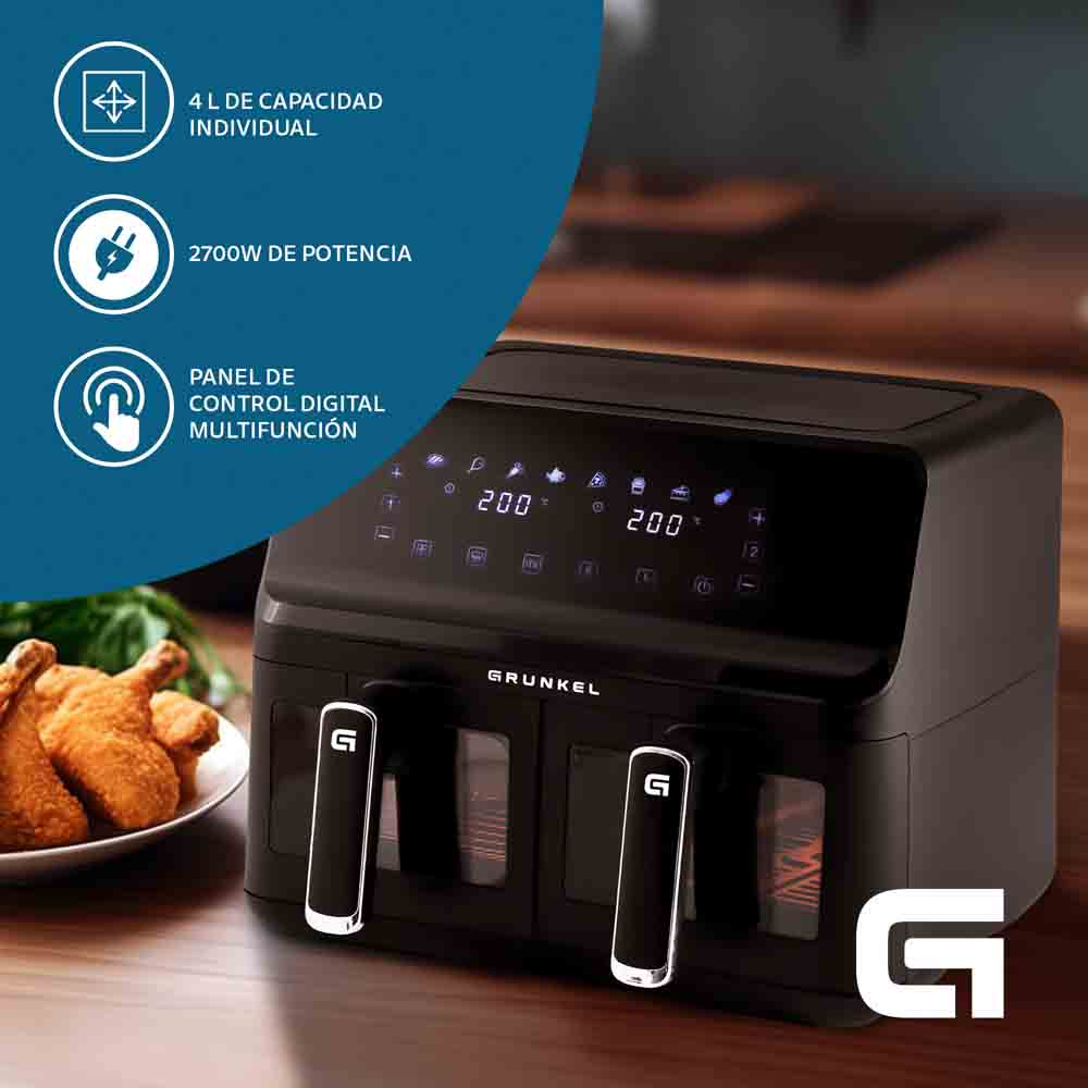Friggitrice ad aria nera con pannello di controllo e due cestelli, preparazione del cibo visibile.