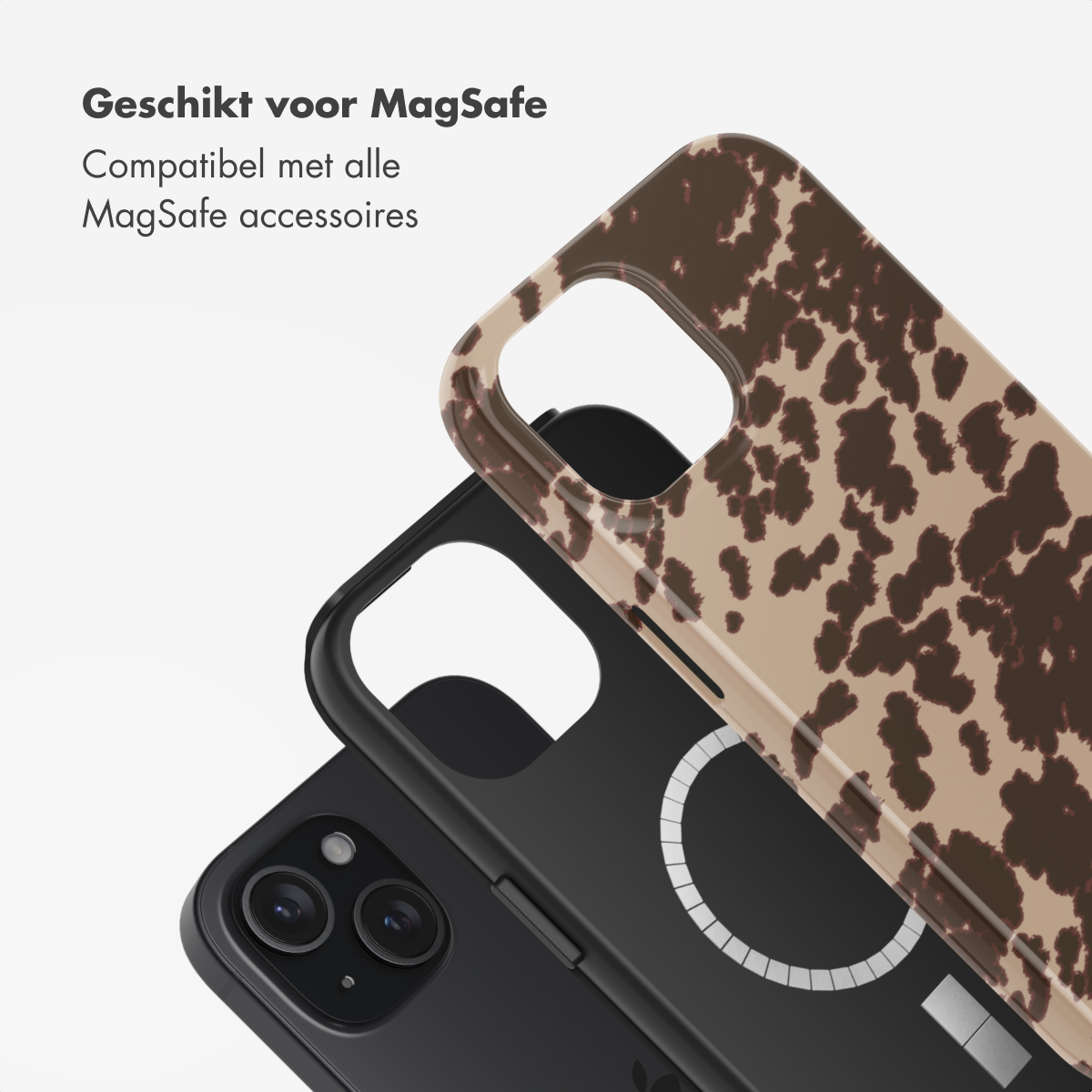 Two phone cases, one with a cow print and one black, on top of a phone, with an Apple logo visible.