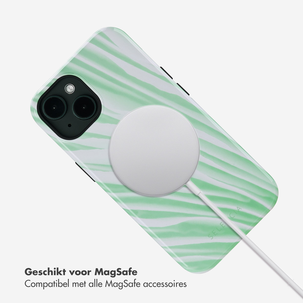 Witte MagSafe-lader op groene zebra-telefoonhoes. Witte kabel.