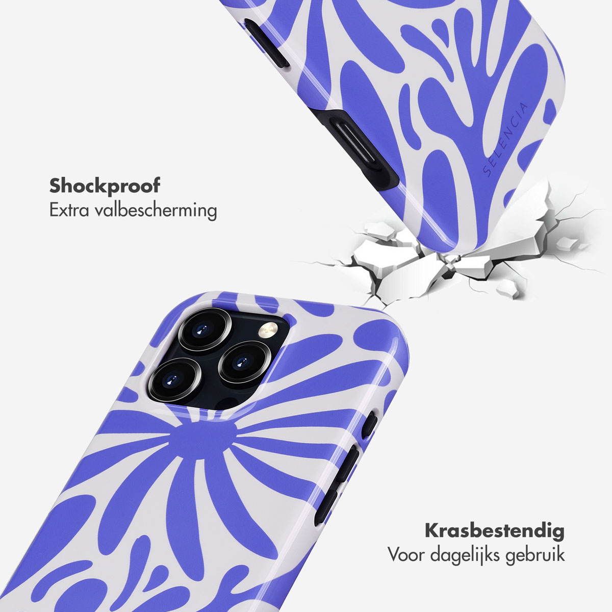 Een telefoonhoesje met een blauw bloemenontwerp breekt.  Een tweede hoesje ligt ernaast.
