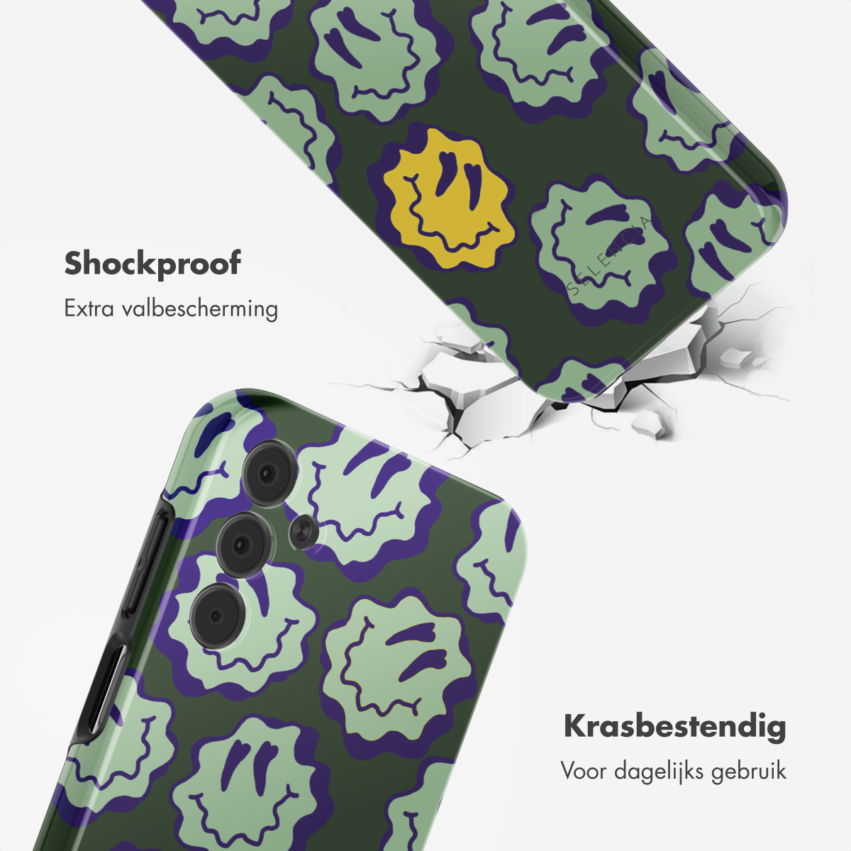 Groene telefoonhoes met smiley-gezichten. Zwarte telefoon met paarse accenten. Witte achtergrond met gebarsten oppervlak.