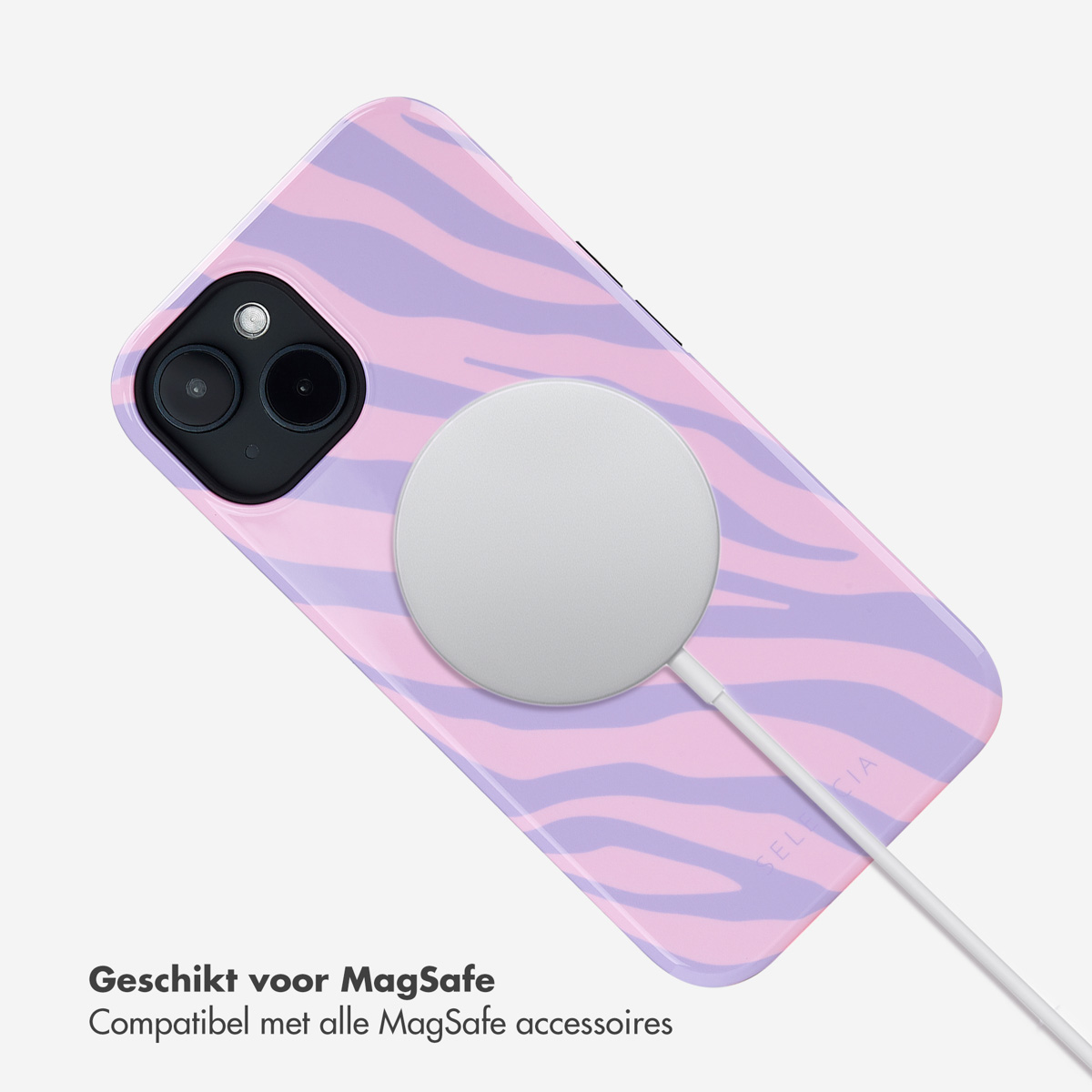 Roze en paarse zebra gestreepte telefoonhoes met een witte cirkelvormige oplader.