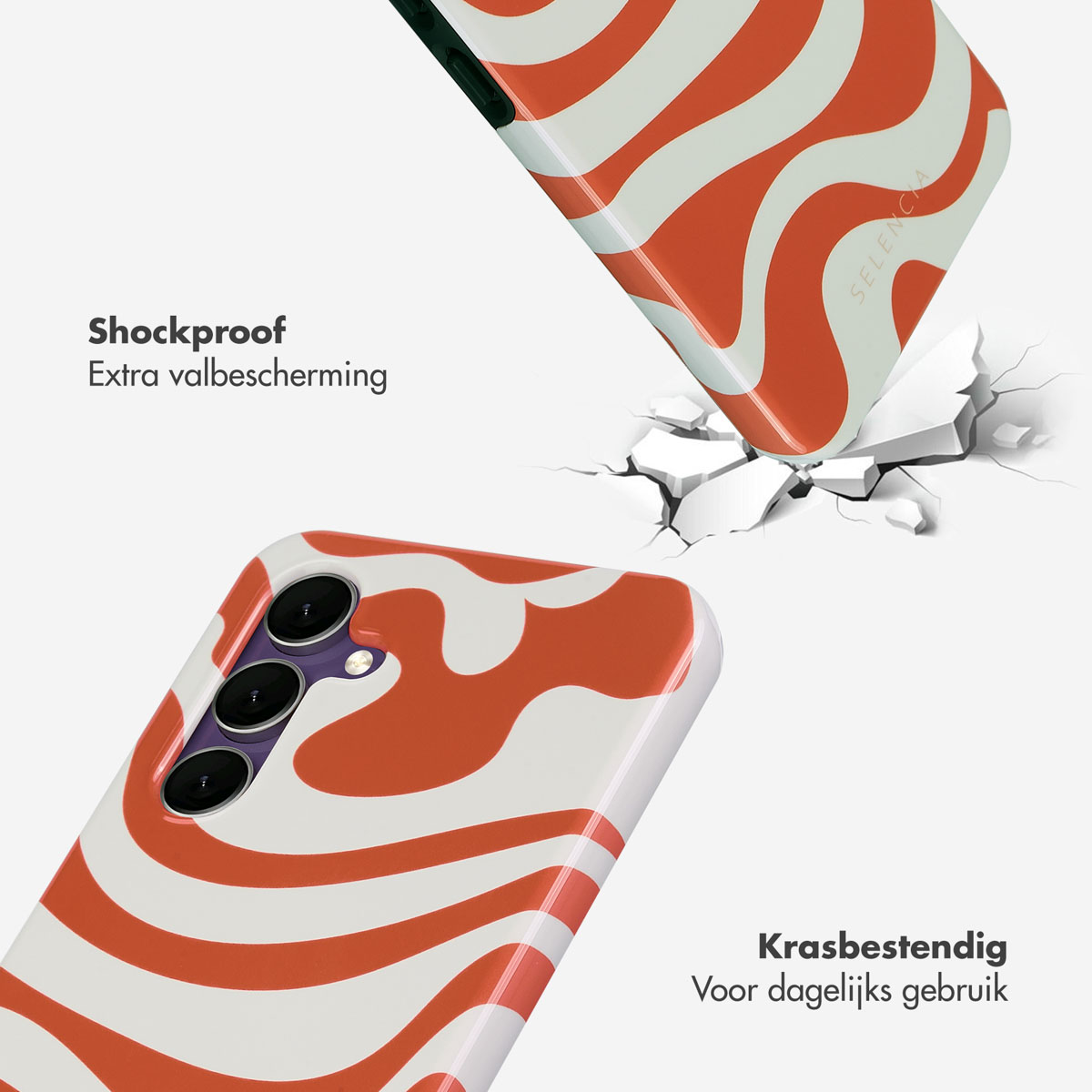 Deux coques de téléphone, une tombant, avec un motif orange et blanc. L'autre est au sol.