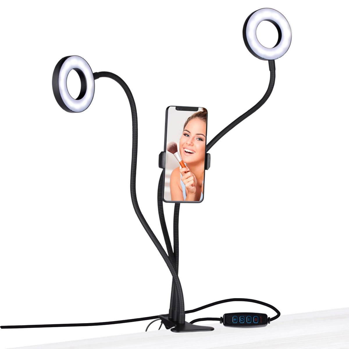 A phone held by a phone holder between two ring lights. A woman is applying makeup.