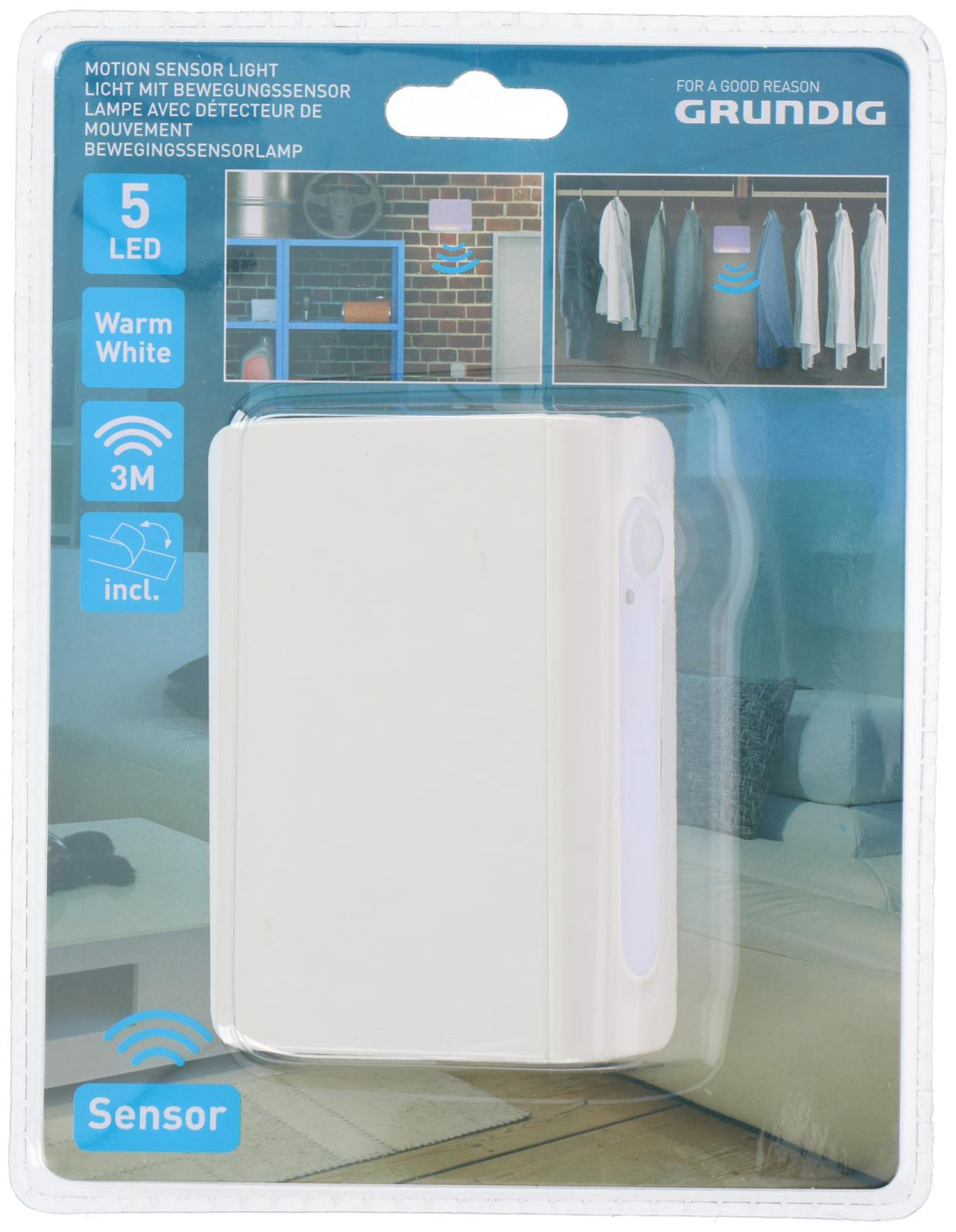 White motion sensor light in a package. The background shows a closet and a brick wall.