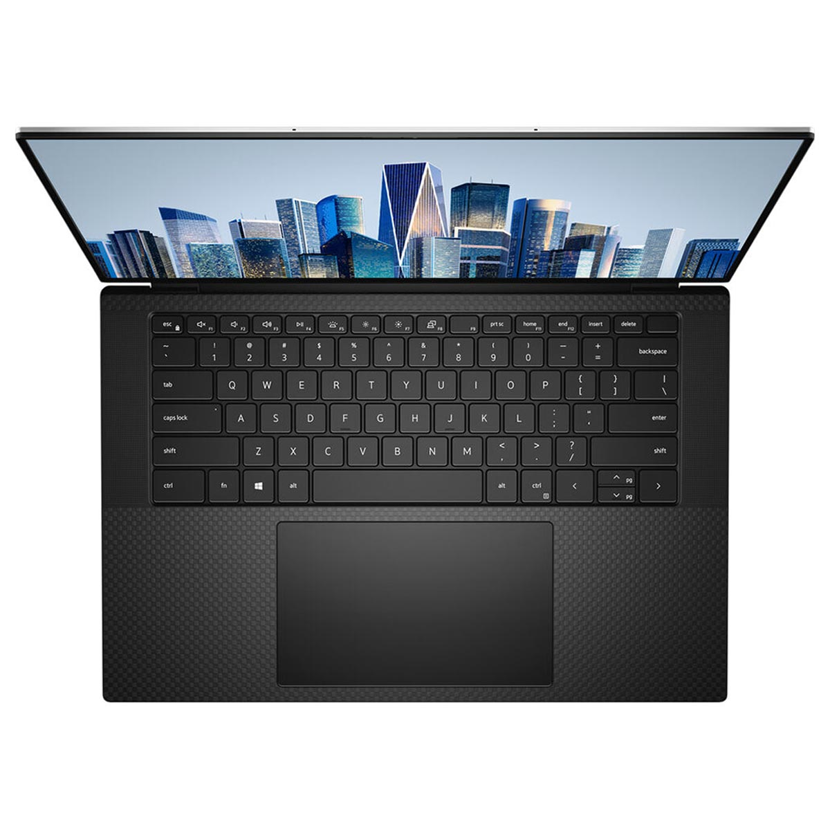 Otwarty laptop, widok z góry. Klawiatura, touchpad widoczny. Pejzaż miejski na ekranie. Czarny i szary.