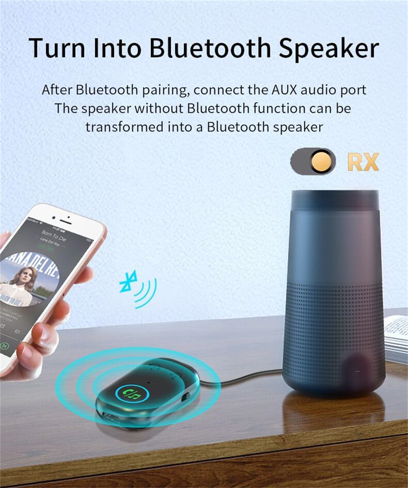 Ein Telefon spielt Musik, verbunden über Bluetooth mit einem Gerät. Dieses Gerät ist mit einem Lautsprecher verbunden. Das RX-Symbol ist sichtbar.