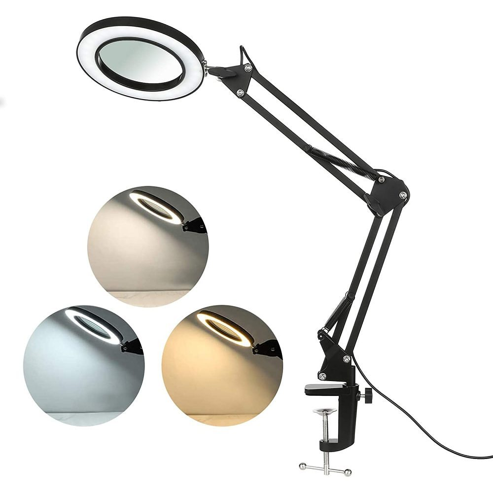 Schwarze Lupe mit kreisförmigem Licht. Drei kleinere Lichter zeigen verschiedene Farbtemperaturen.