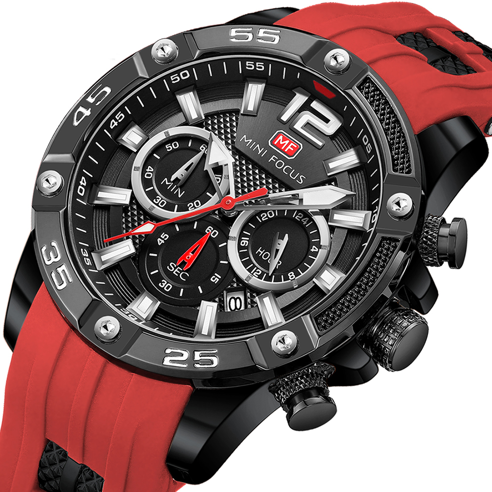 Eine schwarze und rote Uhr mit mehreren Zifferblättern und einem roten Armband. Die Uhr liegt auf weißem Untergrund.