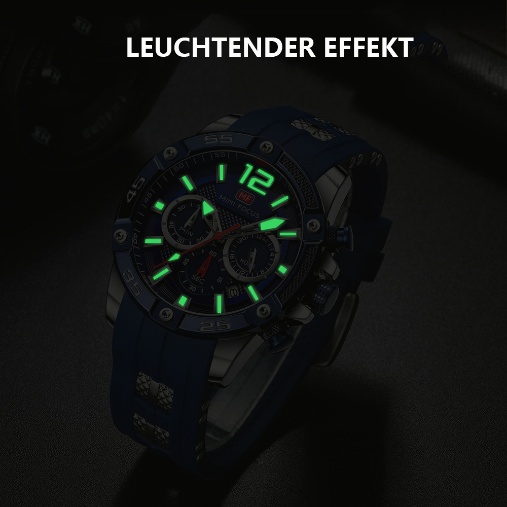 Eine schwarze und blaue Uhr mit leuchtend grünen Ziffern und Zeigern. Die Uhr liegt auf dunklem Untergrund.