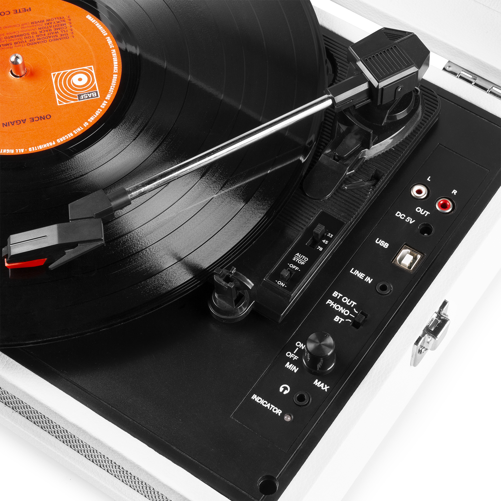 Close up of a record player. A record is on the turntable. Controls are visible.