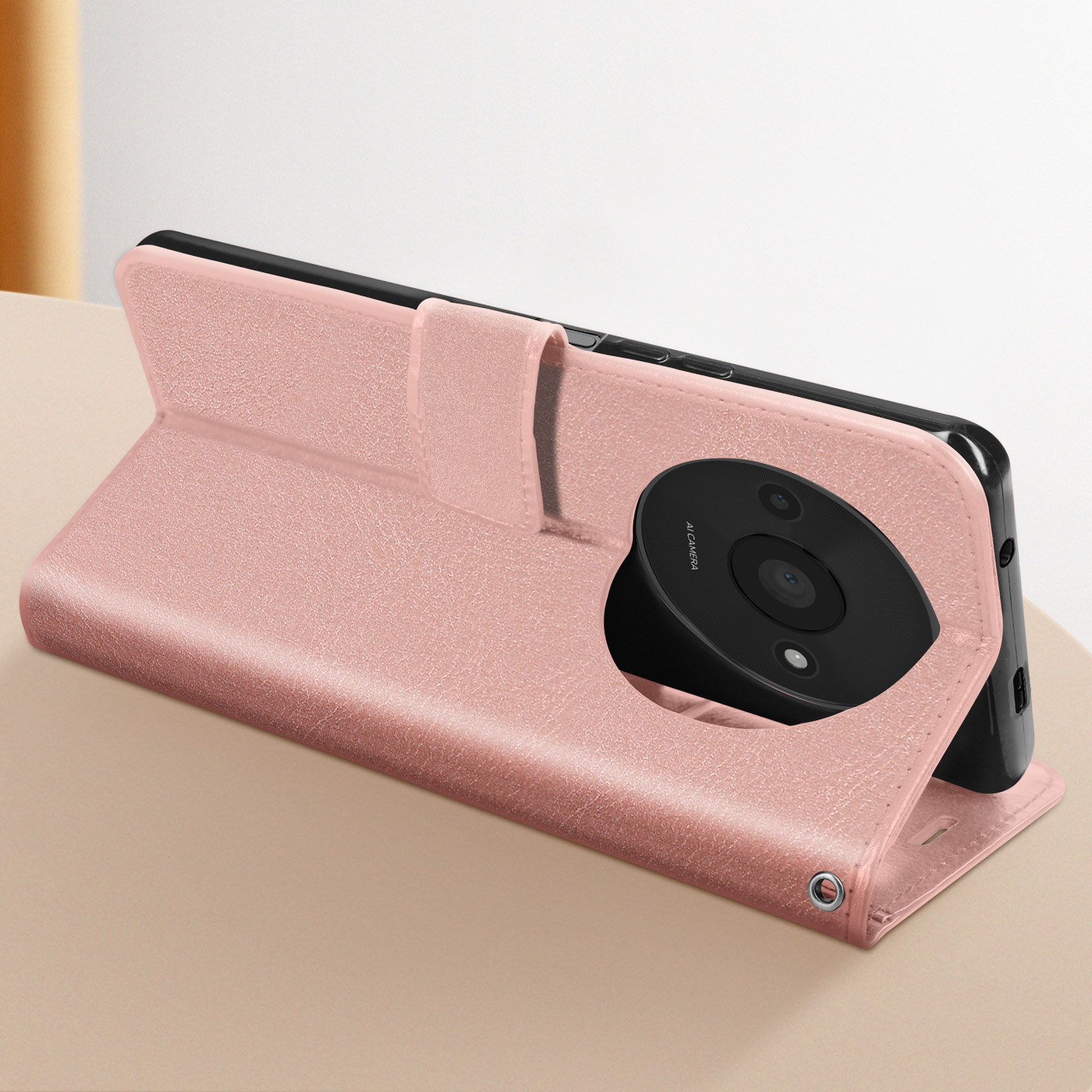Custodia rosa, aperta, con telefono, fotocamera visibile, su una superficie.