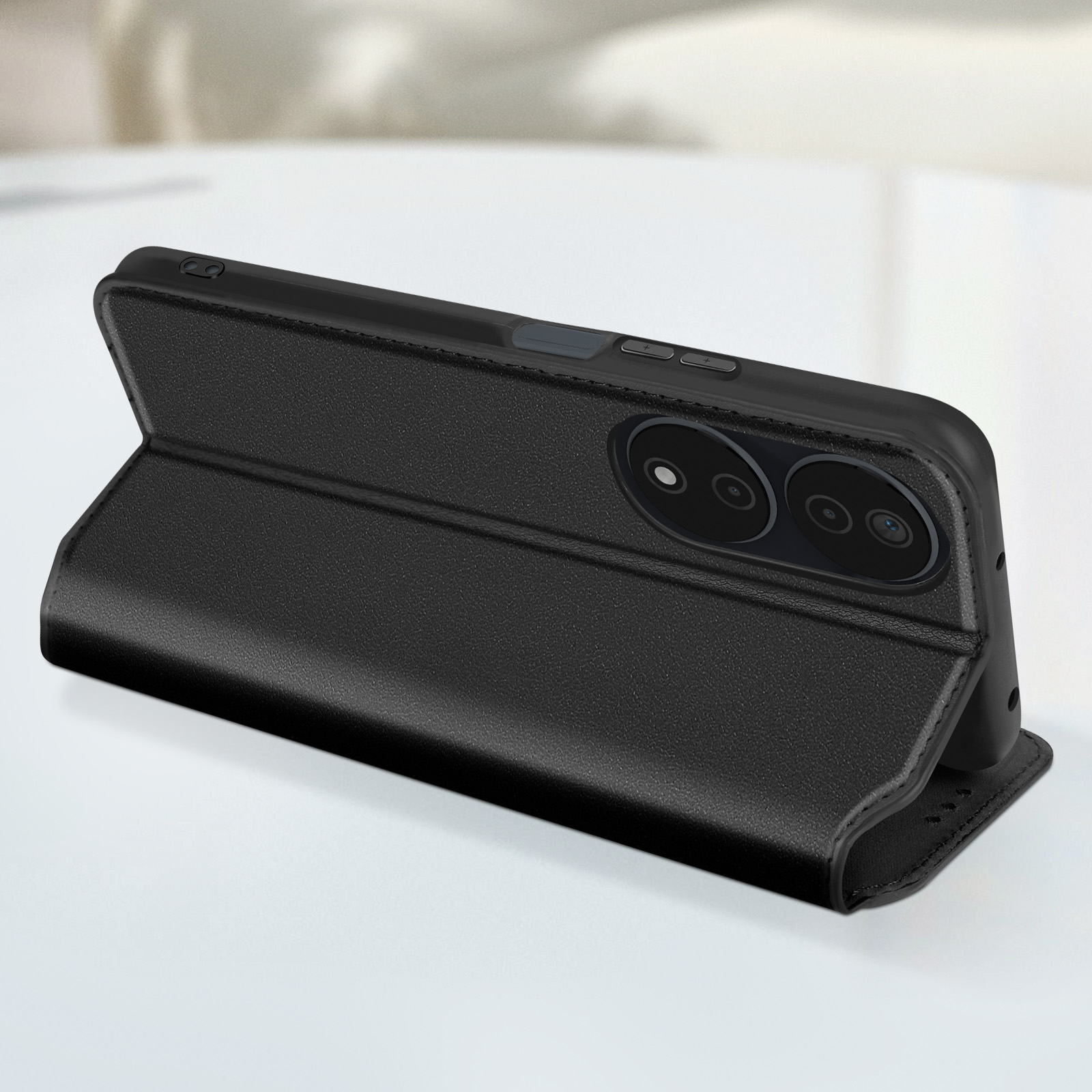 Custodia del telefono nera in modalità supporto con un telefono, che mostra le fotocamere posteriori.