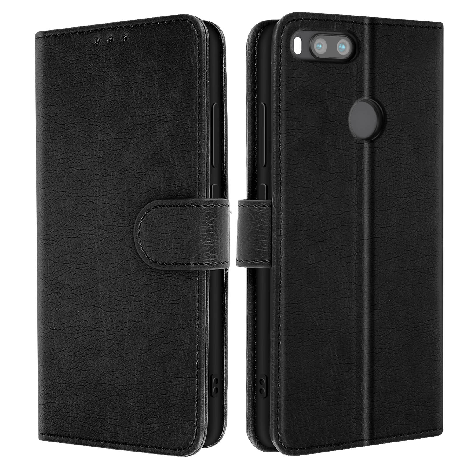Custodia per telefono in pelle nera, aperta e chiusa, con una cover a ribalta. Telefono nero all'interno.