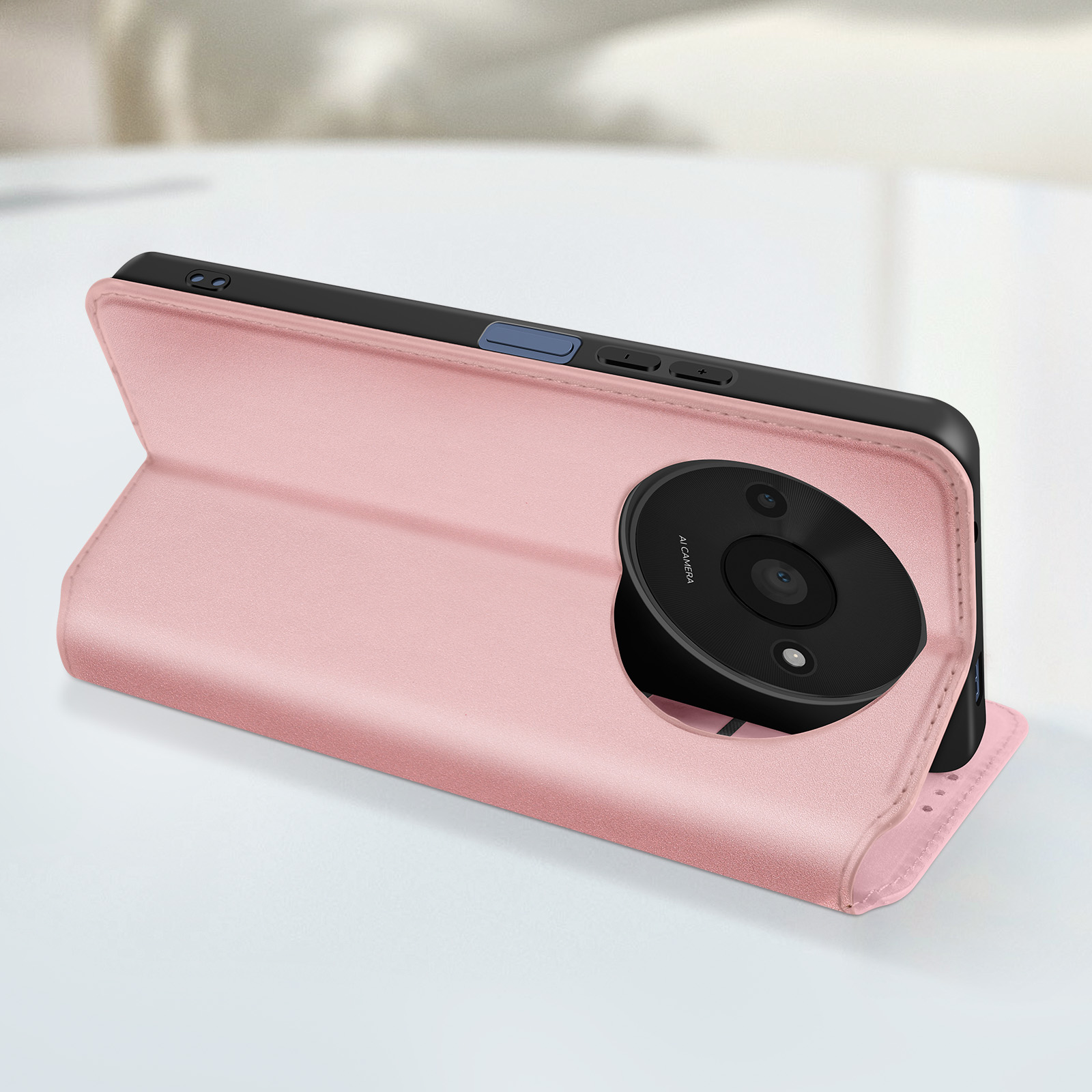 Custodia rosa per telefono con obiettivo rotondo. La custodia è aperta e ha un interno nero.