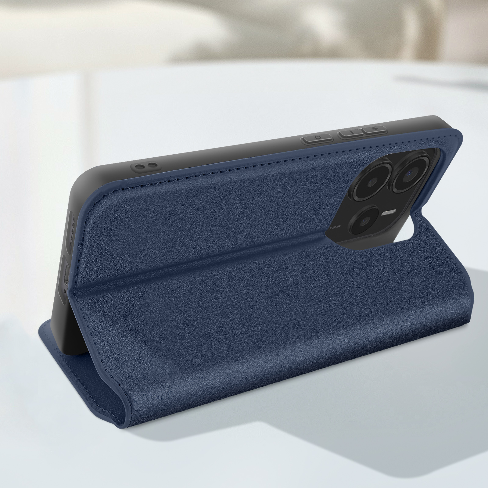 Custodia per telefono blu aperta, che tiene un telefono con fotocamere e pulsanti.