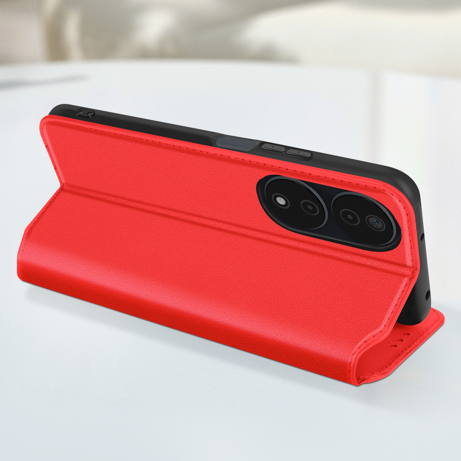 Una custodia per telefono in pelle rossa, aperta, che mostra un telefono.