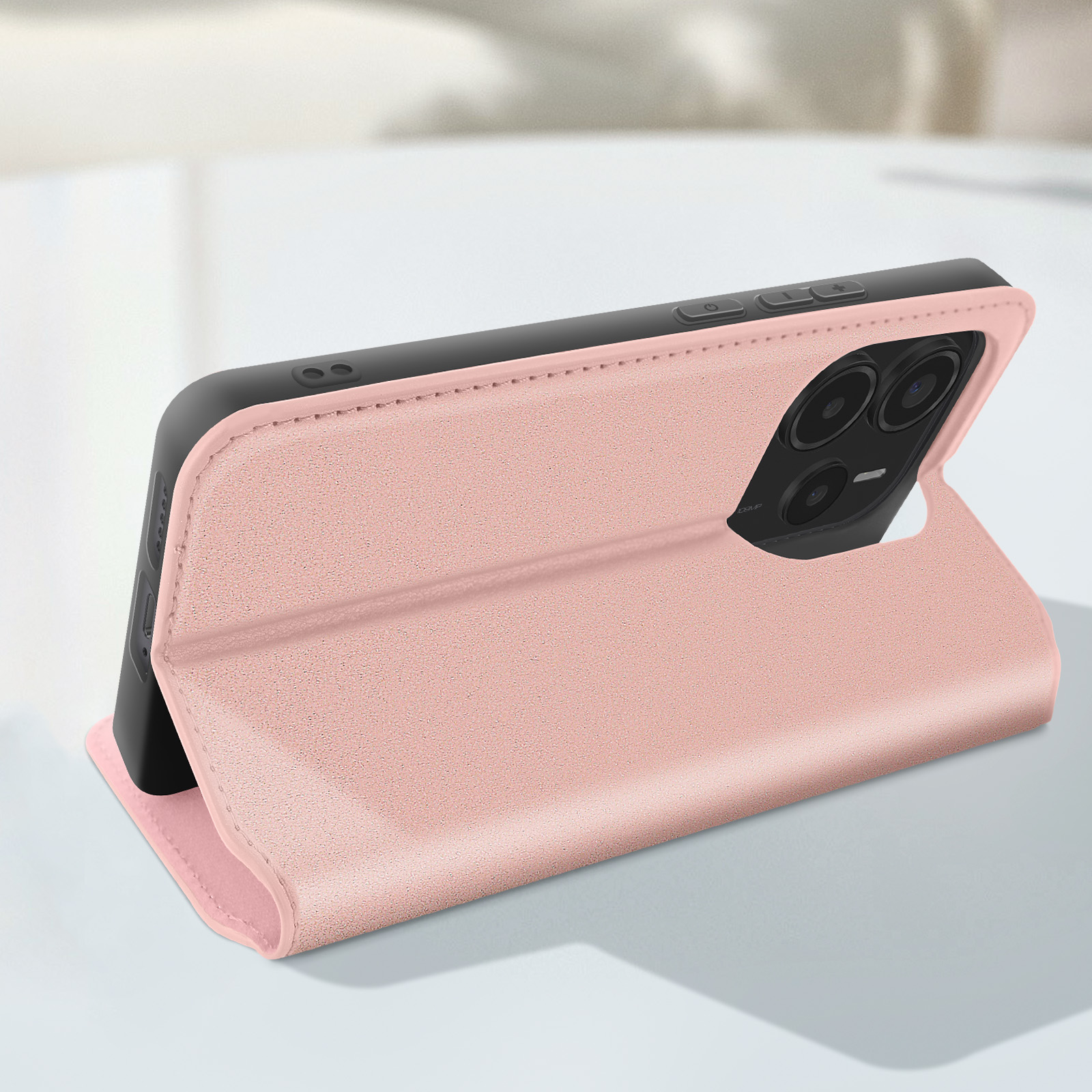Una custodia per telefono rosa, aperta, con un telefono all'interno. Uno sfondo bianco.
