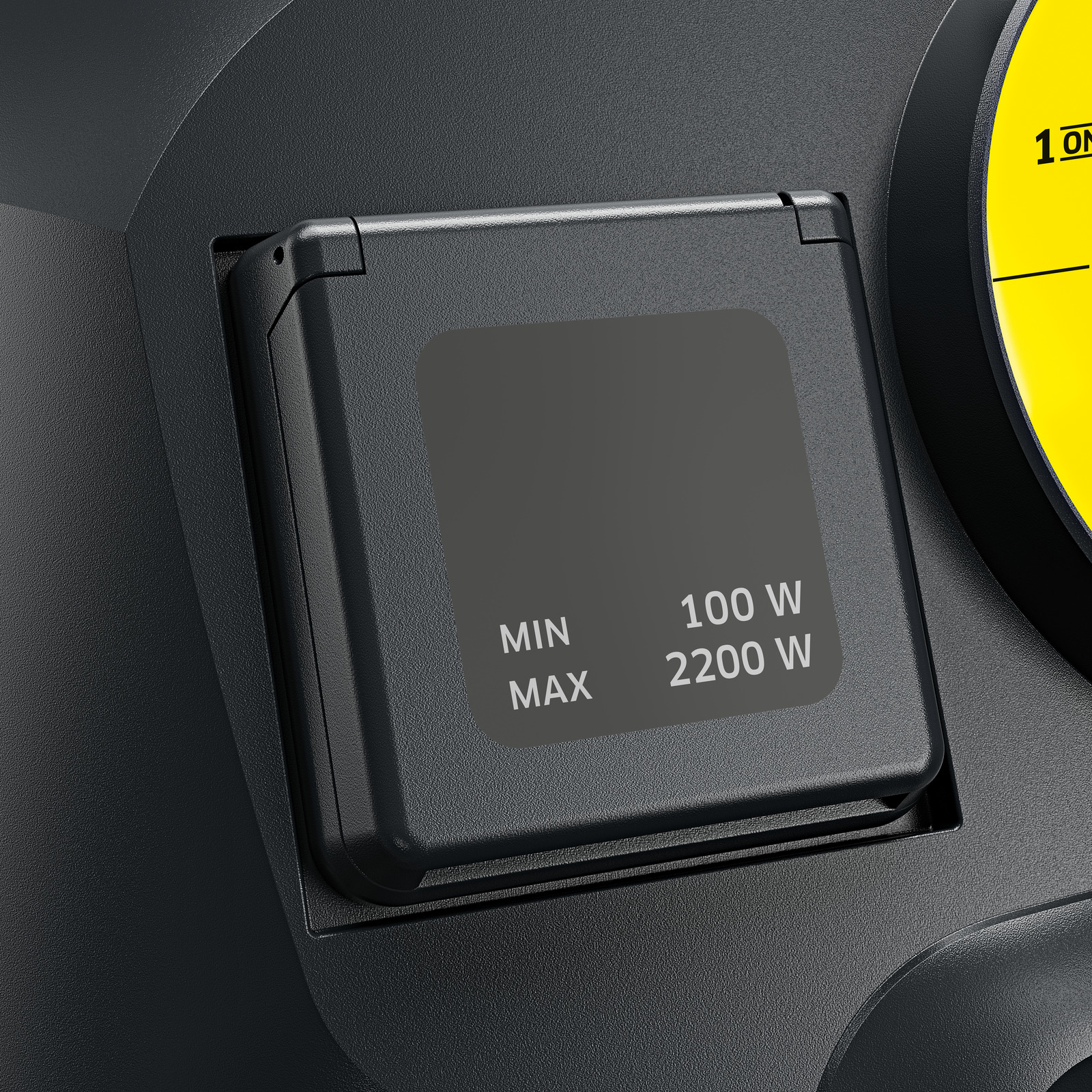 Eine schwarze Steckdose mit quadratischer Abdeckung. Text: MIN 100W, MAX 2200W. Hintergrund ist dunkelgrau.